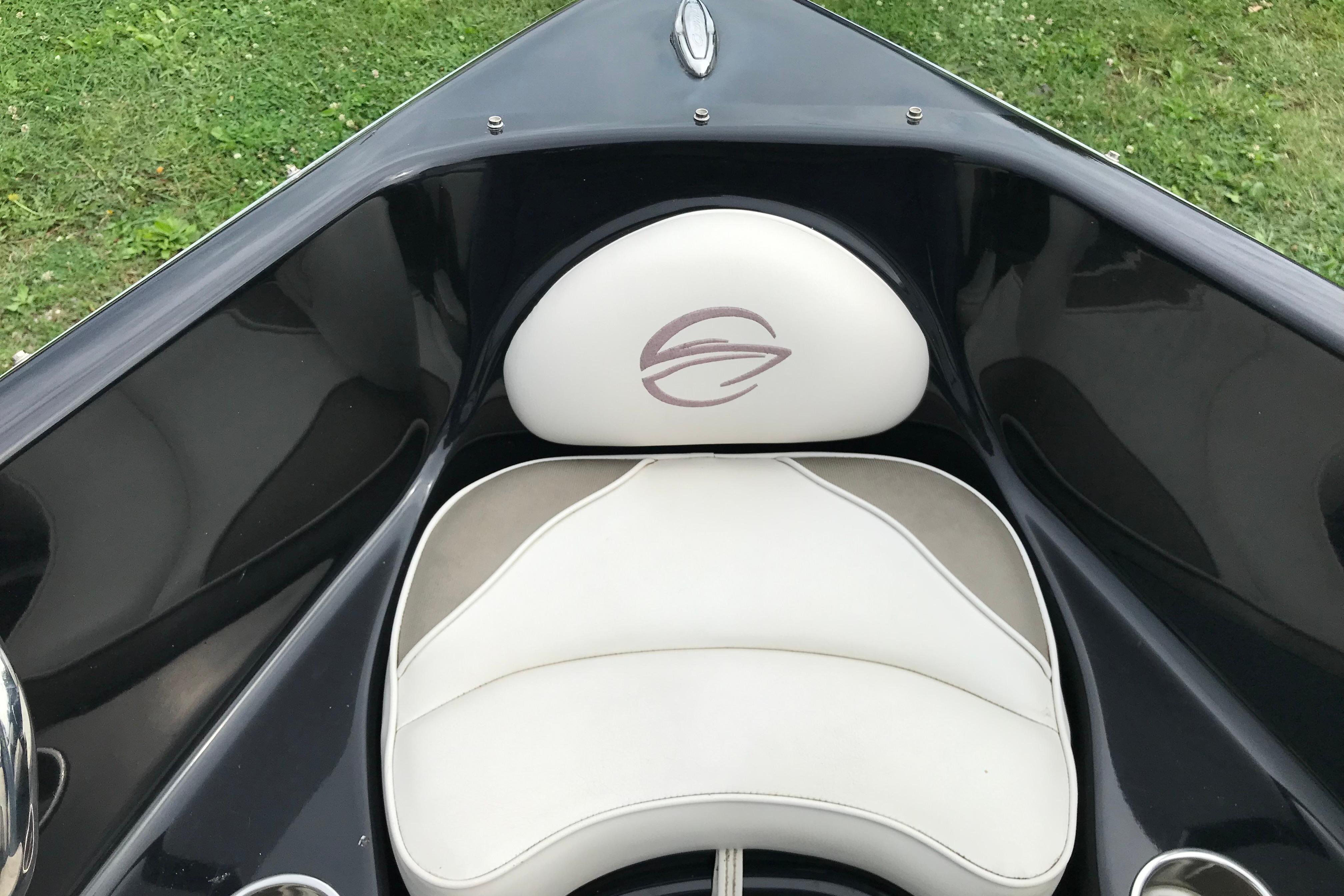 Crownline 18 SS 2015 boat interior with white cushioned seating.