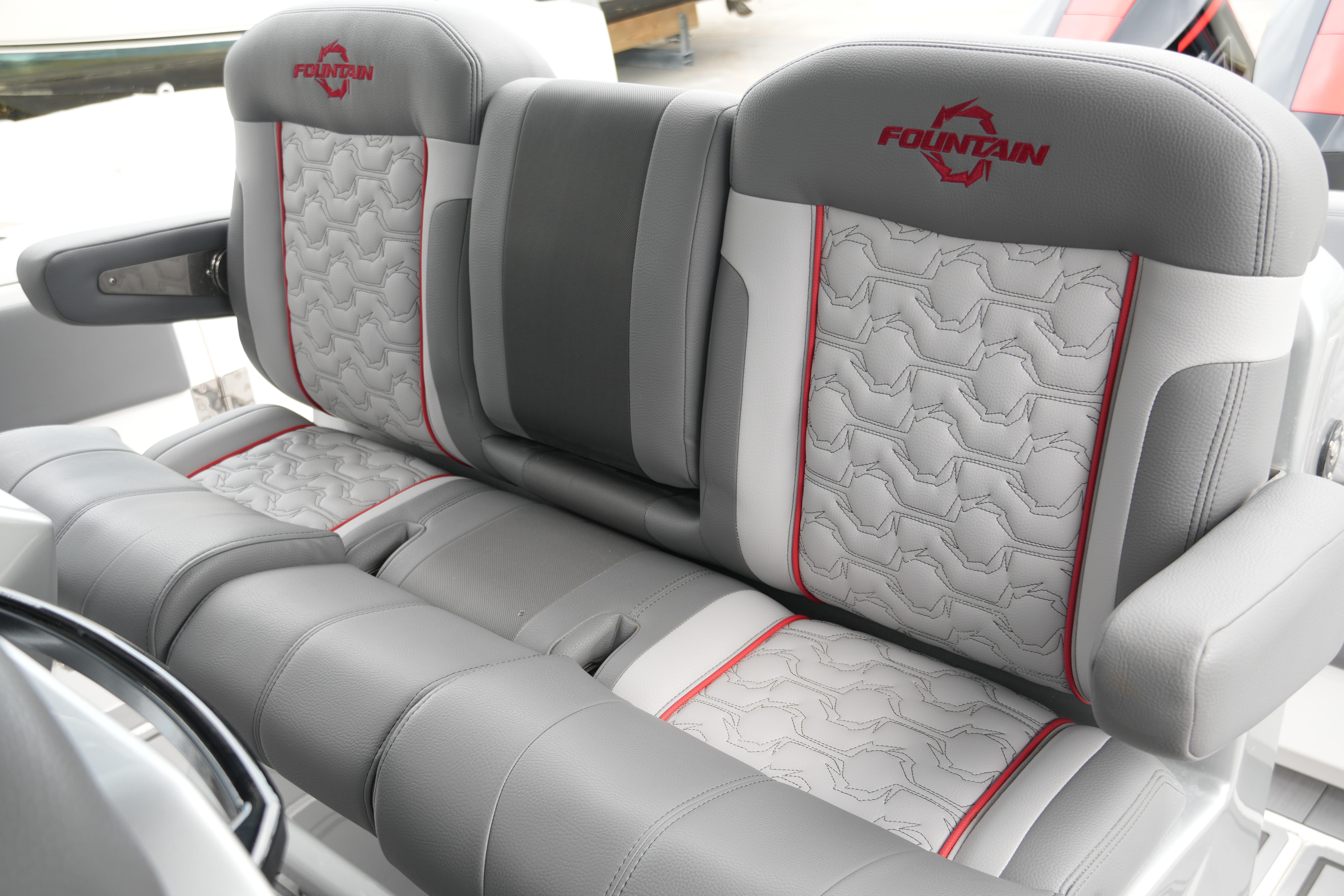 2025 Fountain 38 SCX boat seats with gray and red accents, showcasing luxury design.