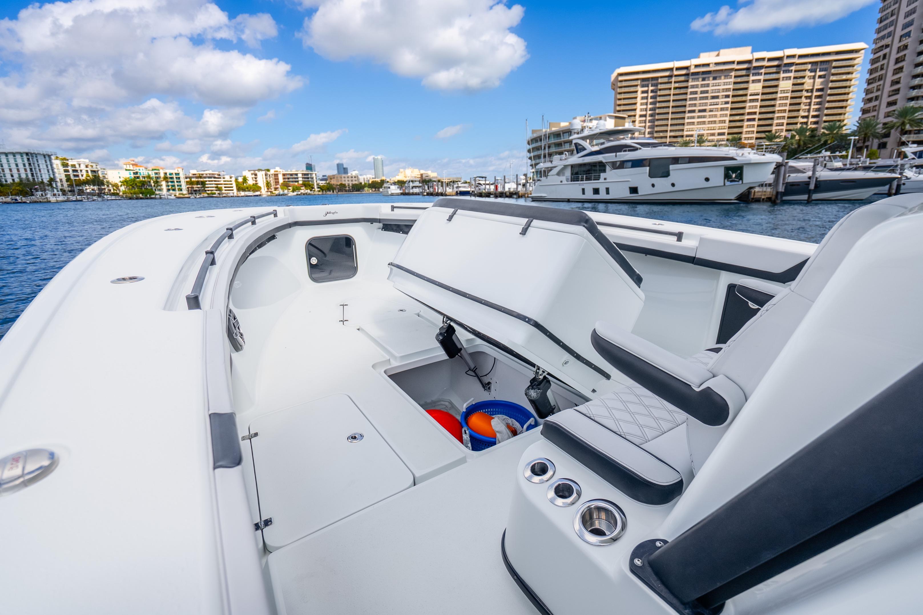 2024 Yellowfin 39 Offshore boat interior with open storage, docked in marina.