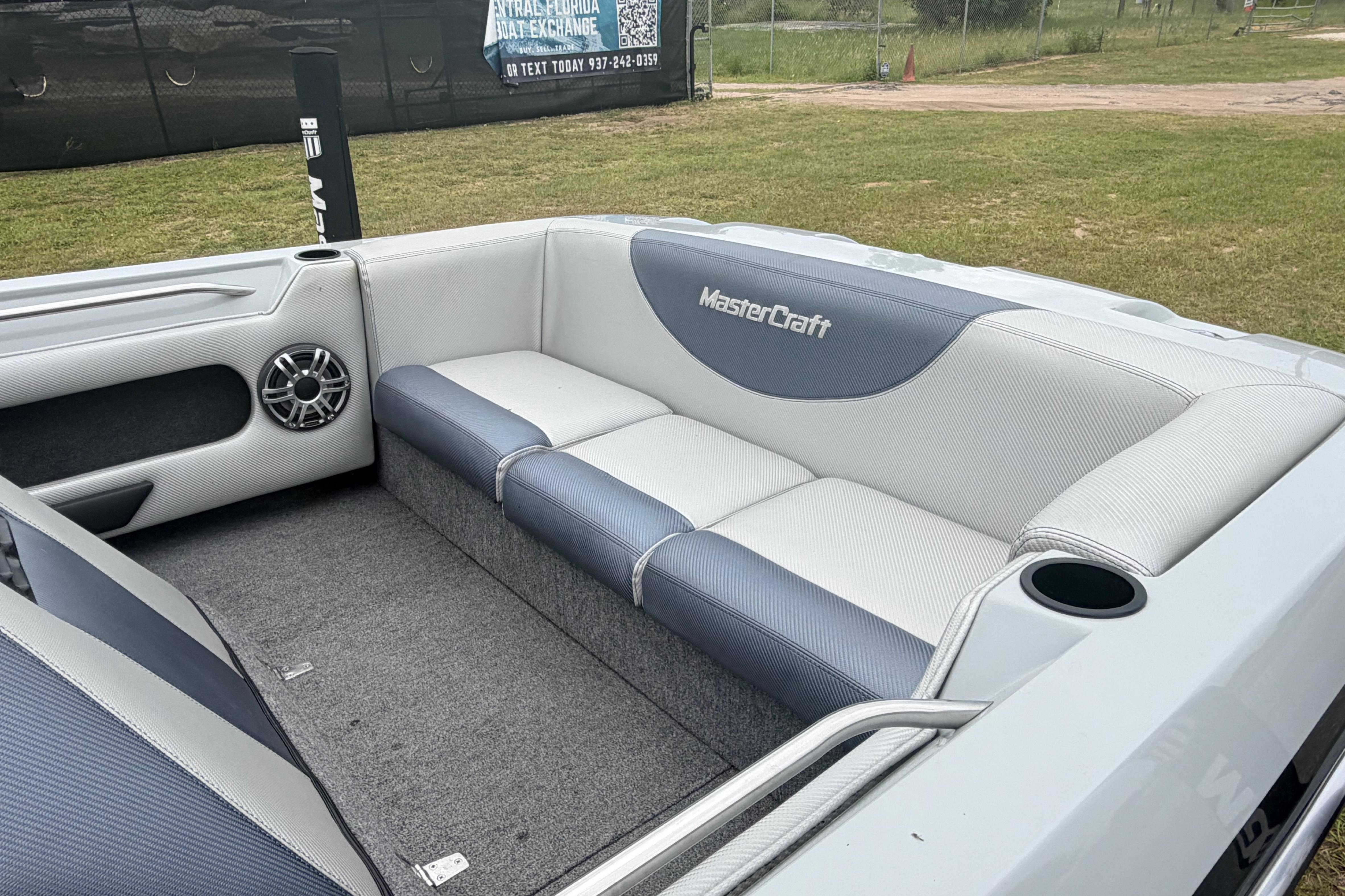 1989 MasterCraft ProStar 190 interior with gray seating and speaker detail.