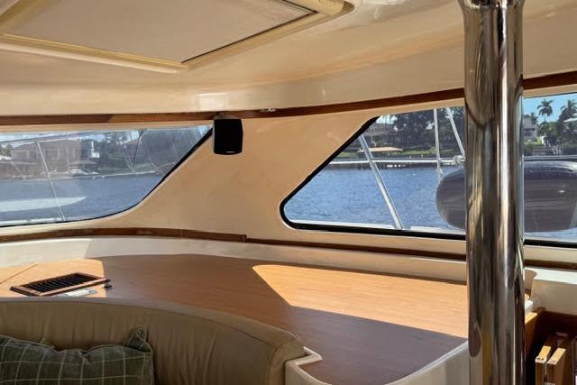 Interior view of 2007 Africat Marine 420 yacht with large windows and seating area.