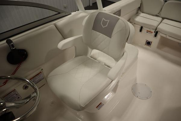 2025 Sea Fox 228 Traveler boat interior with white captain's chair and seating.