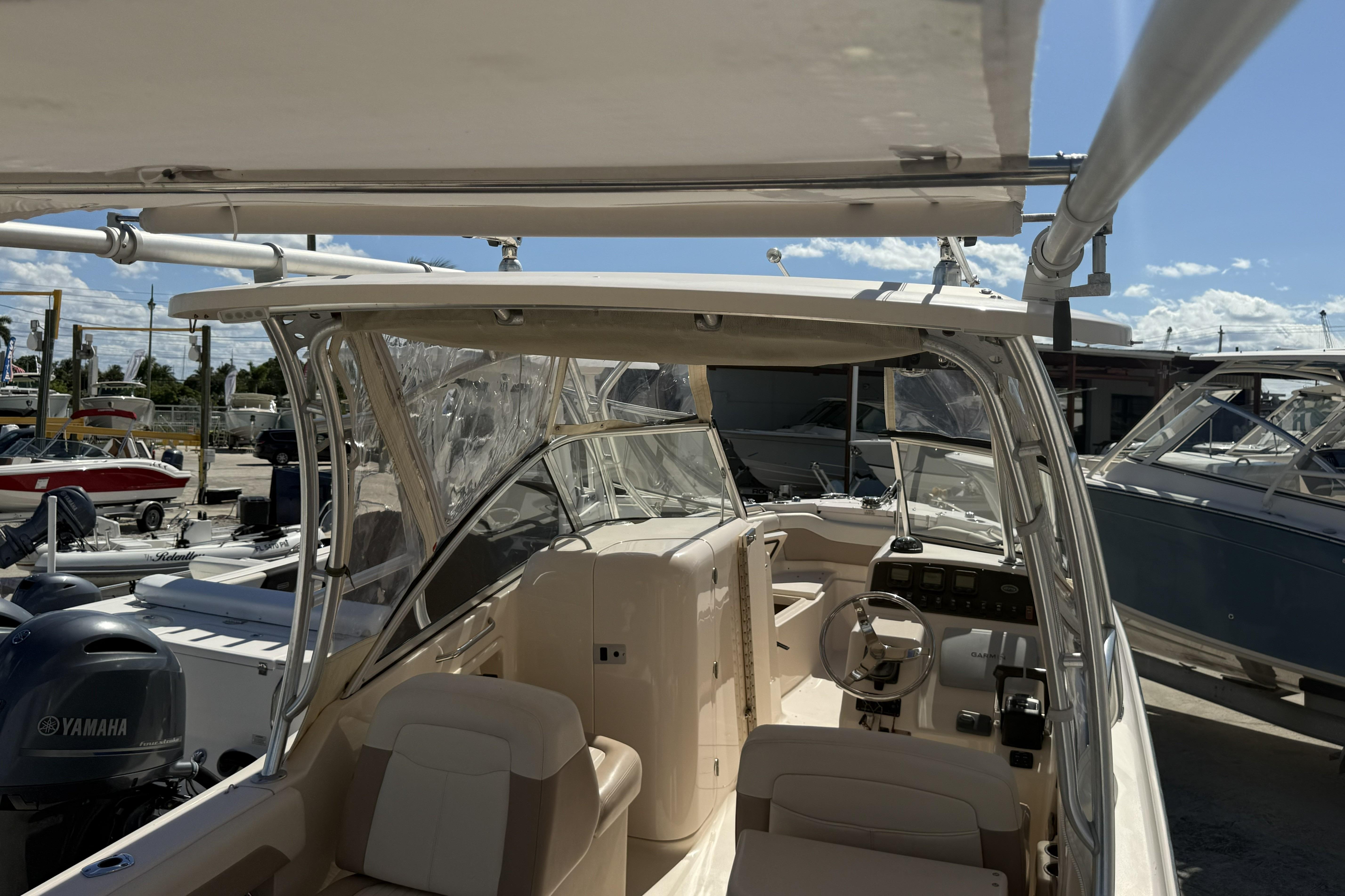 2014 Grady-White Freedom 275 boat interior with seating and steering console.