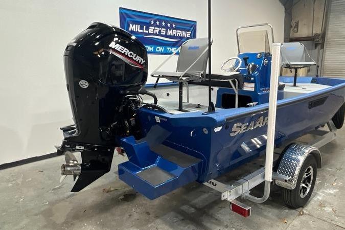 2025 SeaArk Shadow 187T boat with Mercury engine in showroom setting.