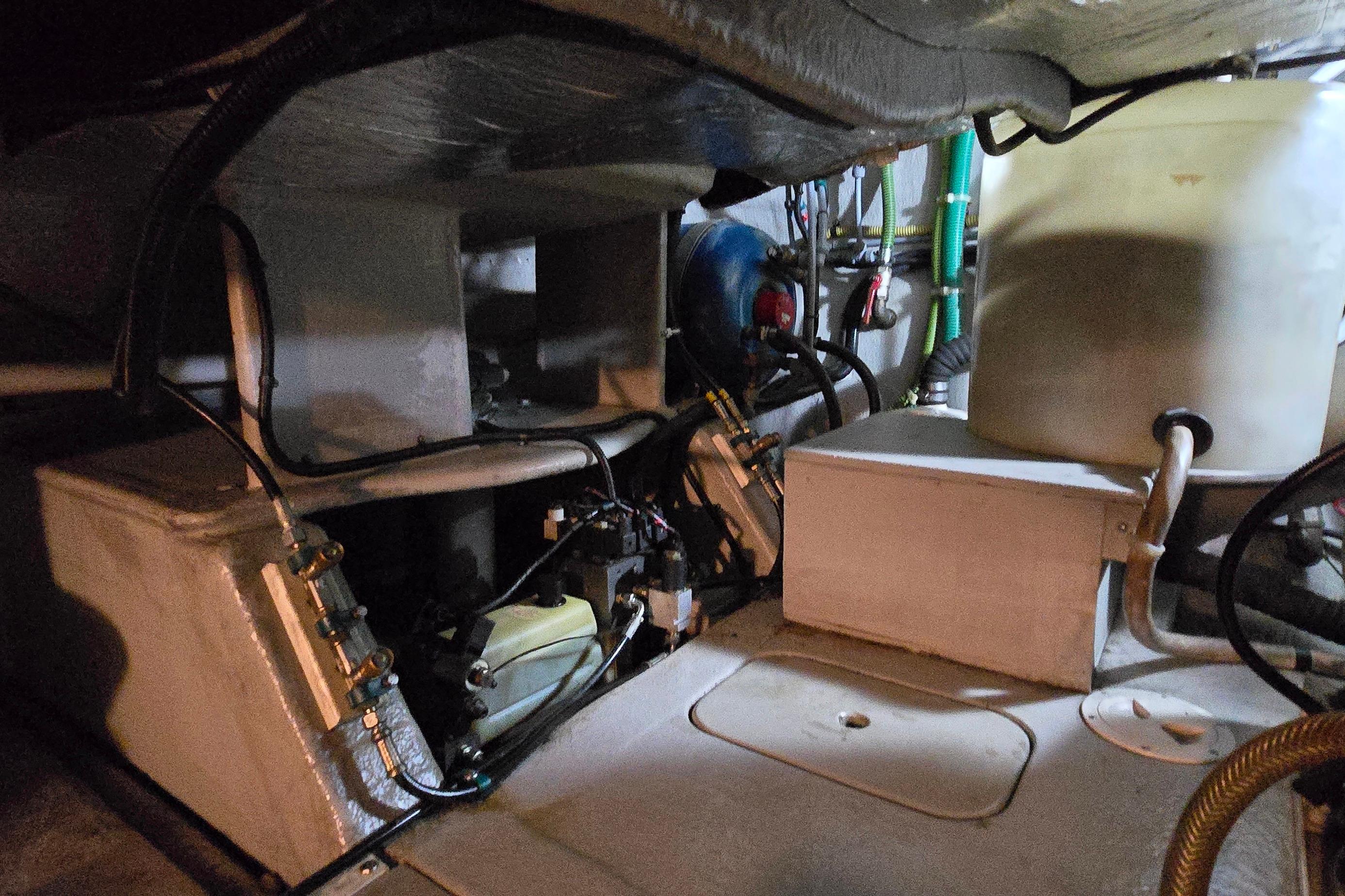 Engine room of a 2004 Sunseeker Camargue 50 yacht, showcasing mechanical components.