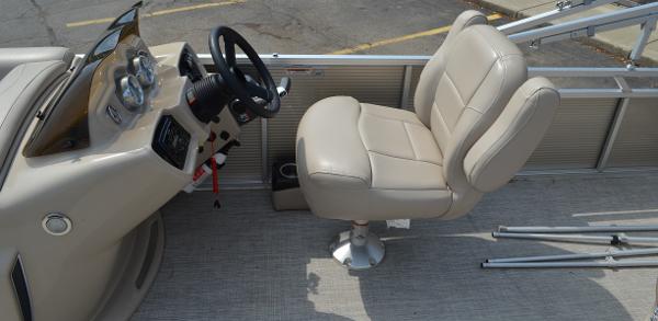 2018 Tahoe LTZ 2285 CR boat interior with beige captain's chair and steering console.