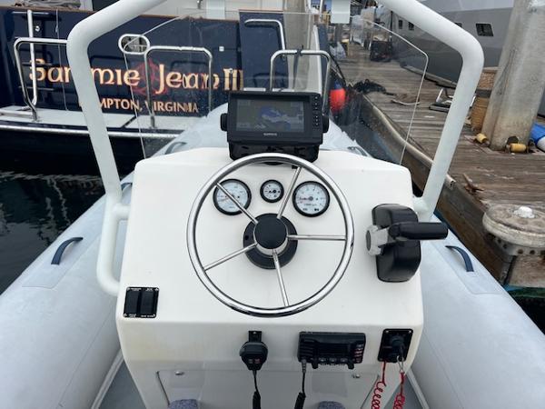 2017 Highfield OM 500 boat dashboard with steering wheel, gauges, and navigation system.