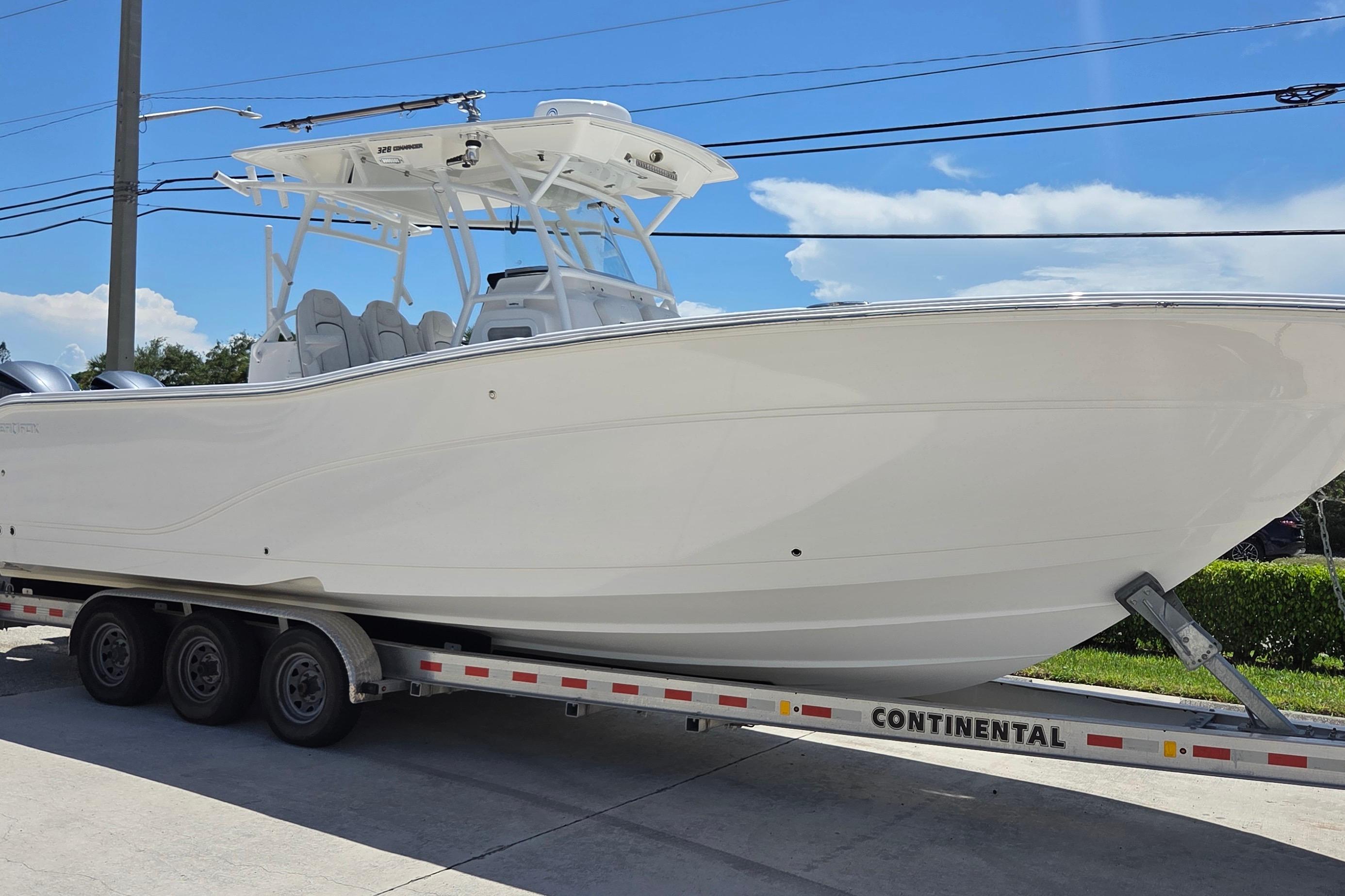 2021 Sea Fox 328 Commander boat on trailer under clear blue sky.