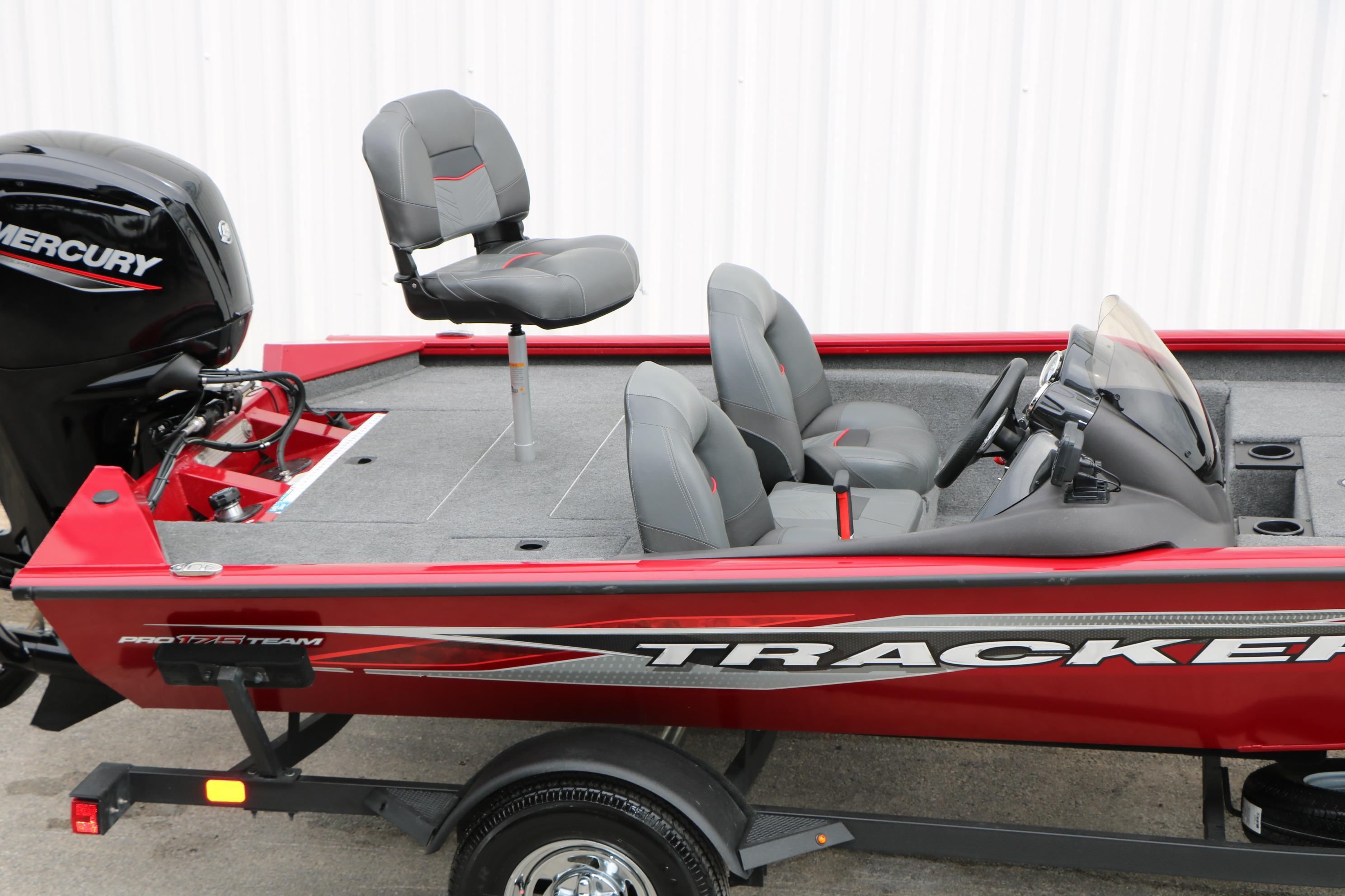 2024 Tracker Pro Team 175 boat with Mercury engine, red exterior, and gray seating.