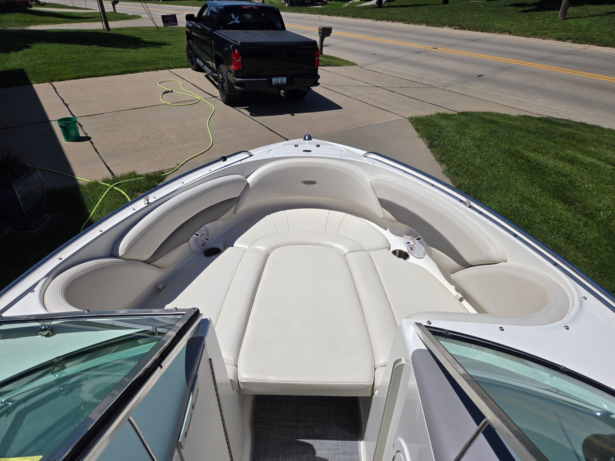 The image shows the bow of a Chaparral 220 SSi boat with white cushioned seating.