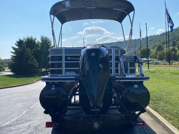 2024 Ranger Reata 223C pontoon boat with canopy, parked on a sunny day.