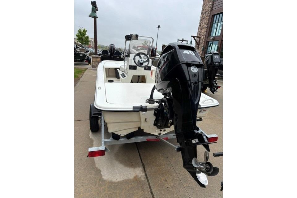 2025 Mako Pro Skiff 13 CC boat on trailer, featuring a powerful outboard motor.