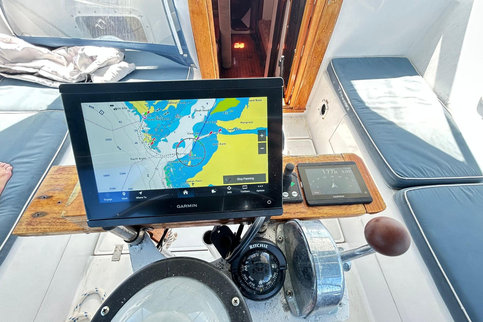 Cockpit of 1987 Gulfstar CSY 50 Pilot House with Garmin navigation display.