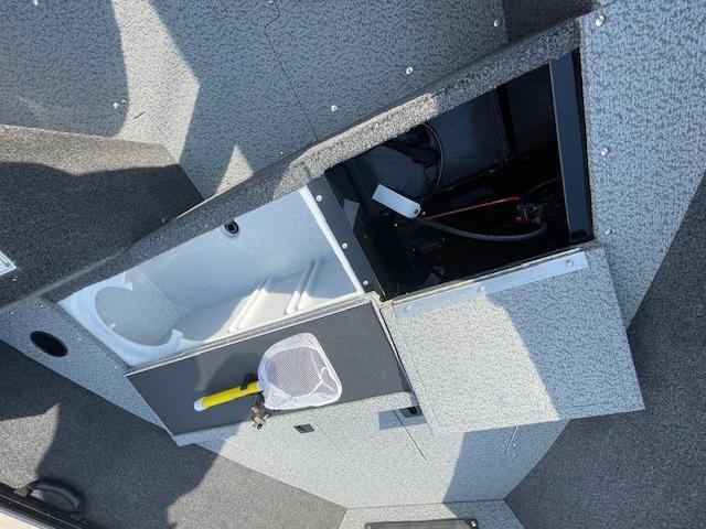2025 Lund 1650 Rebel XL SS boat interior storage compartments with fishing net.