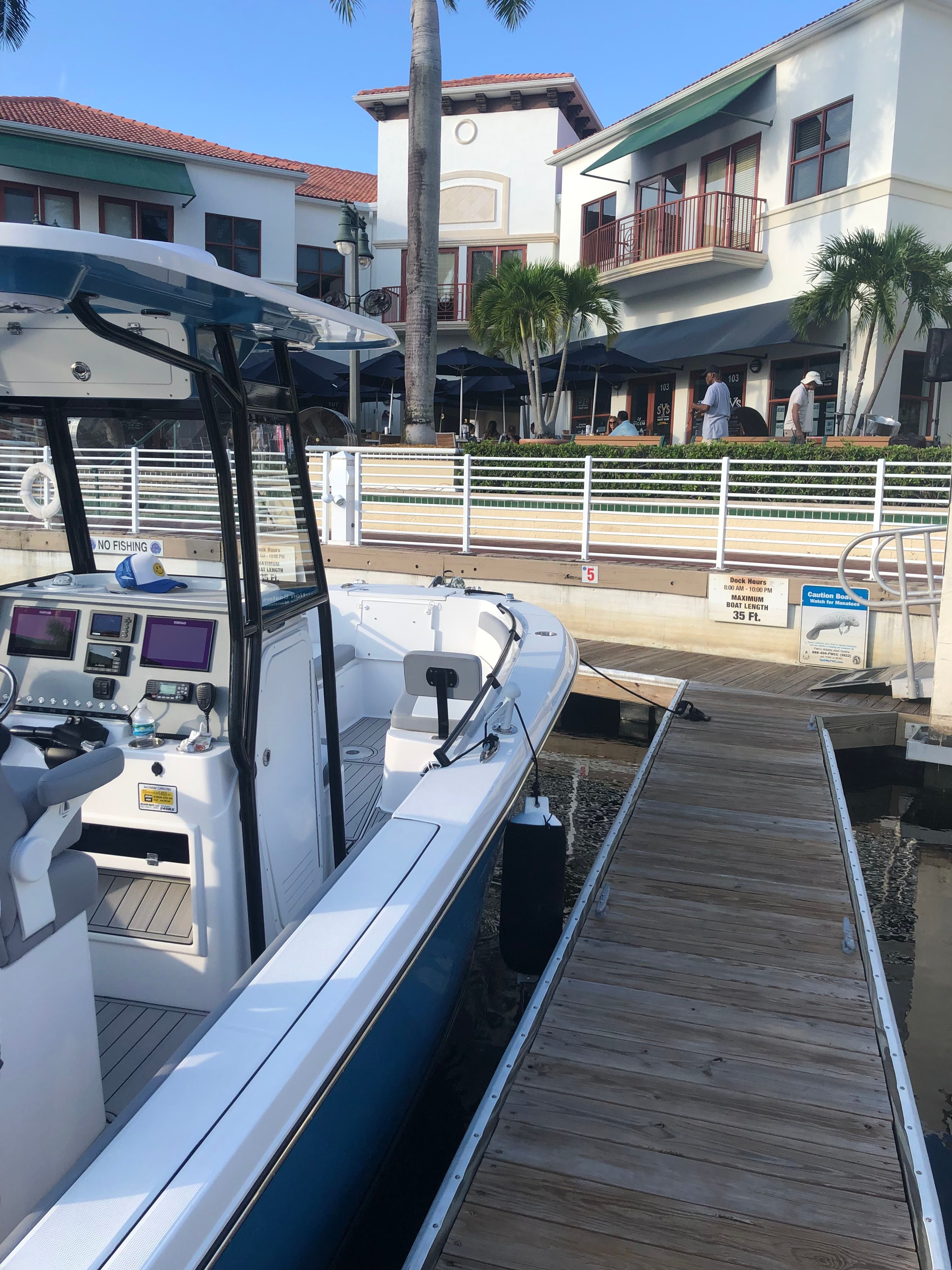 Release 240 RX boat docked near buildings, 2022.