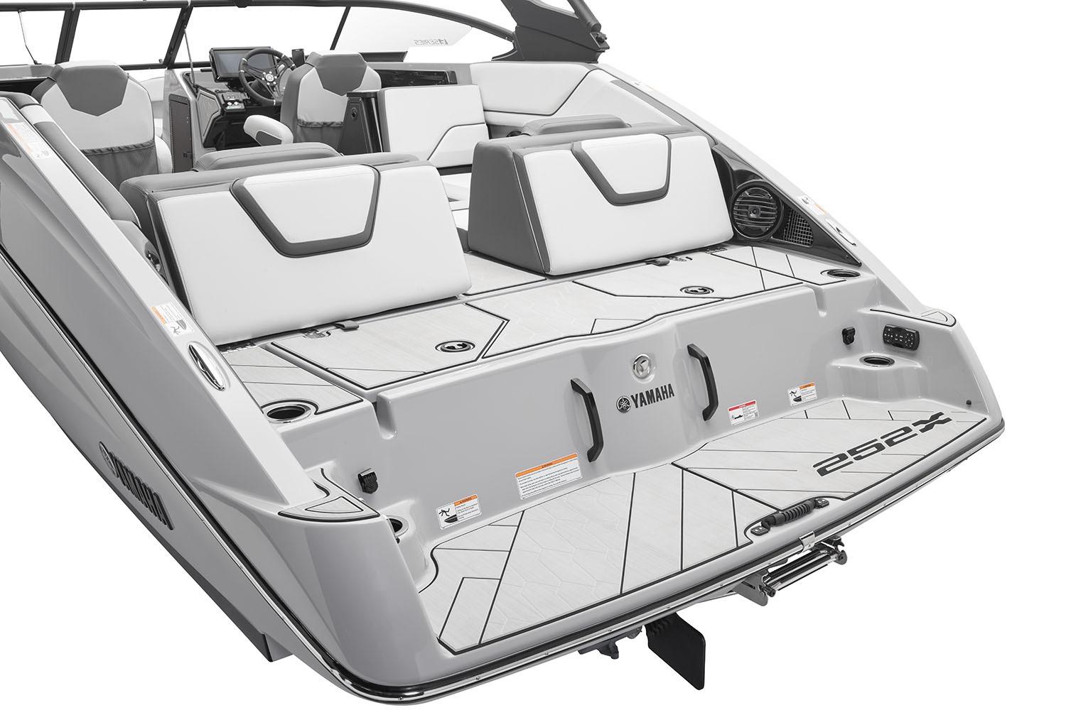 Manufacturer Provided Image: 2026 Yamaha Boats 252XE, sleek design, spacious seating, modern interior, rear view.