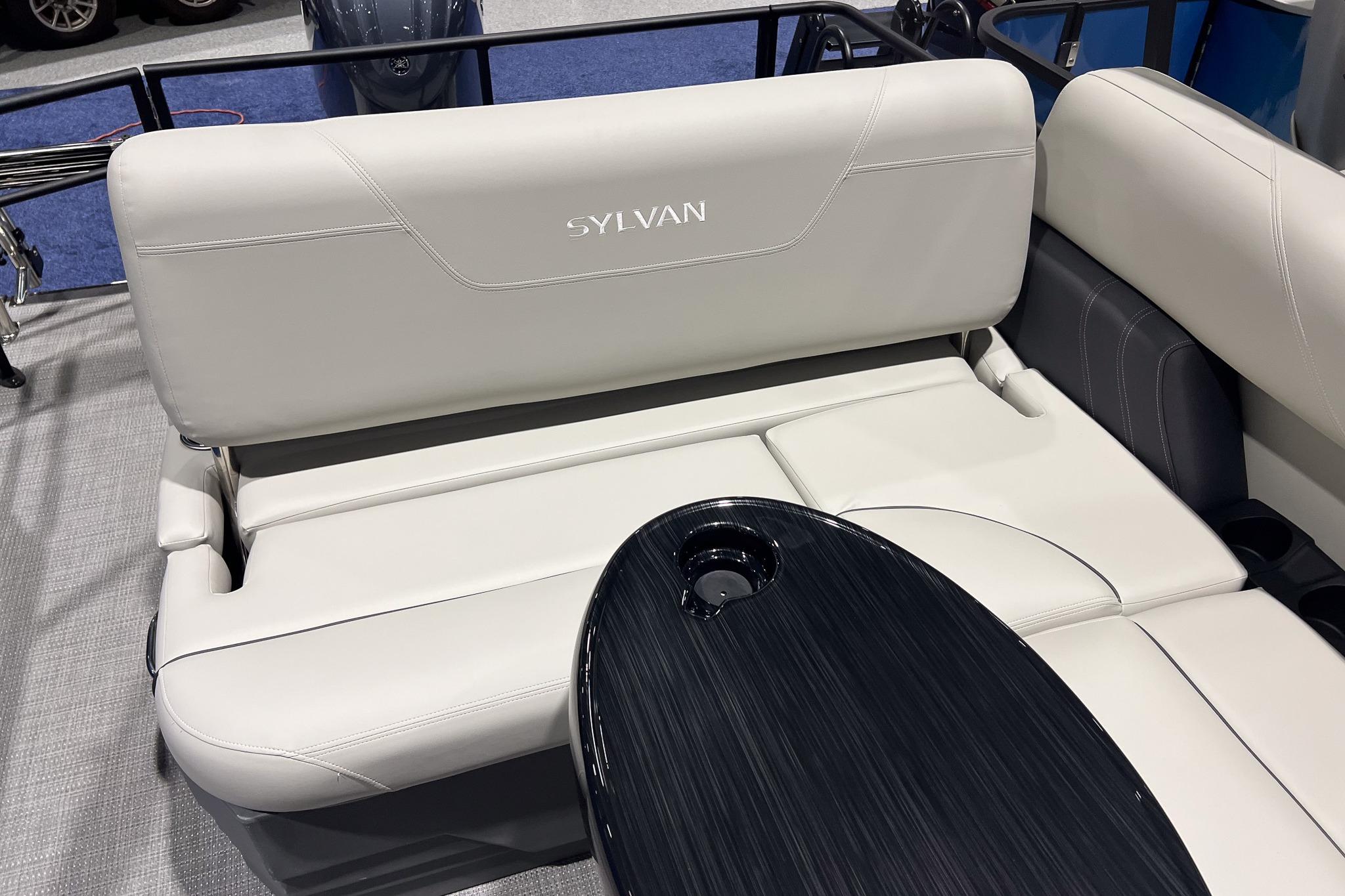 2026 Sylvan Mirage 822 CLZ boat interior with sleek seating and modern table design.