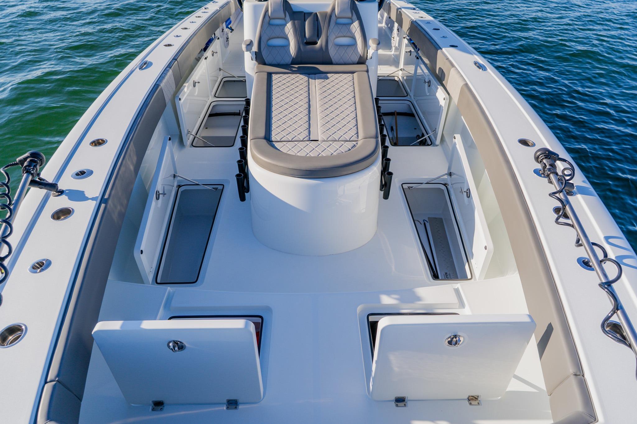 2025 Freeman 42LR boat interior with seating and storage compartments on calm water.