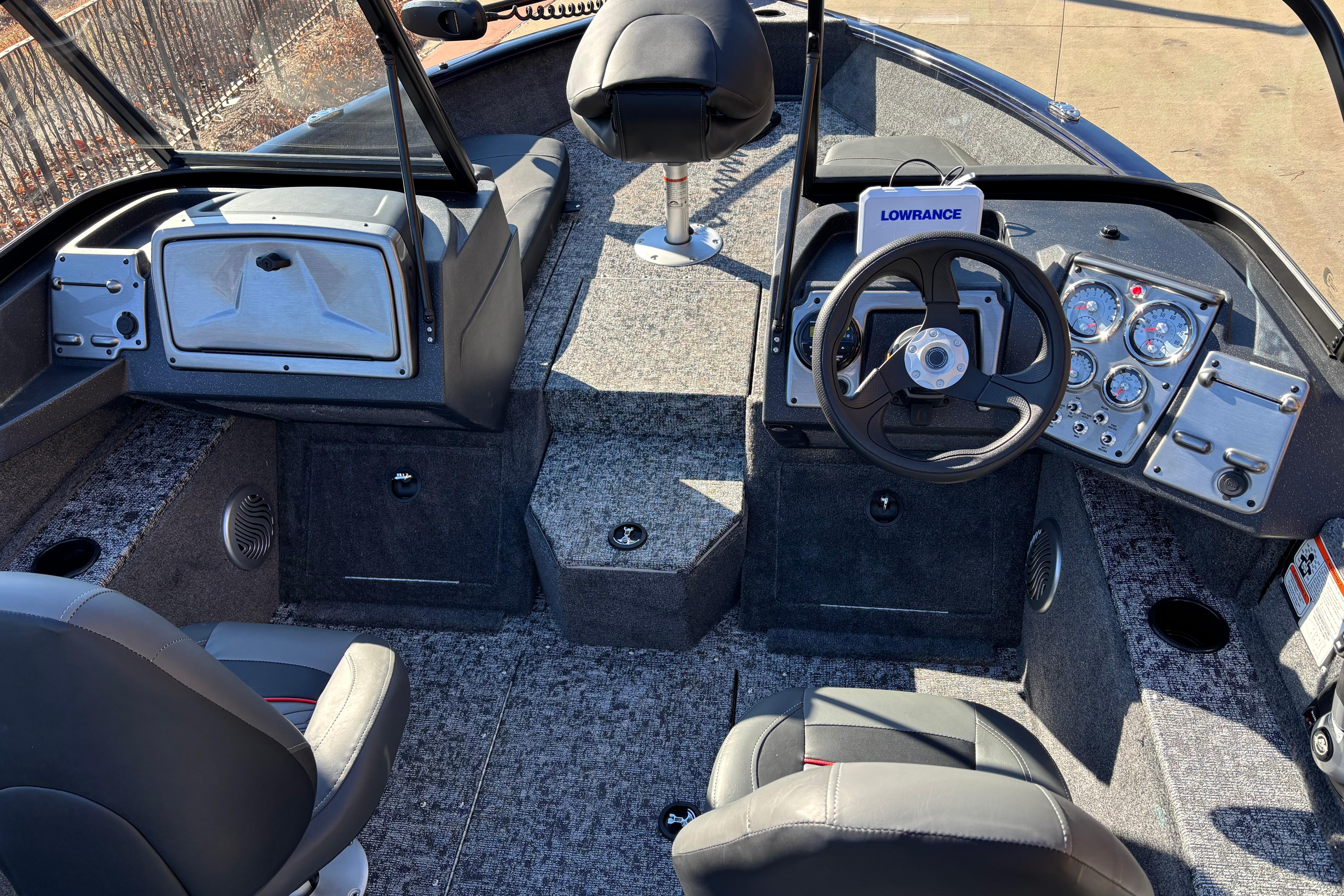 2026 Tracker Pro Guide V-175 Combo boat interior with steering wheel and dashboard controls.