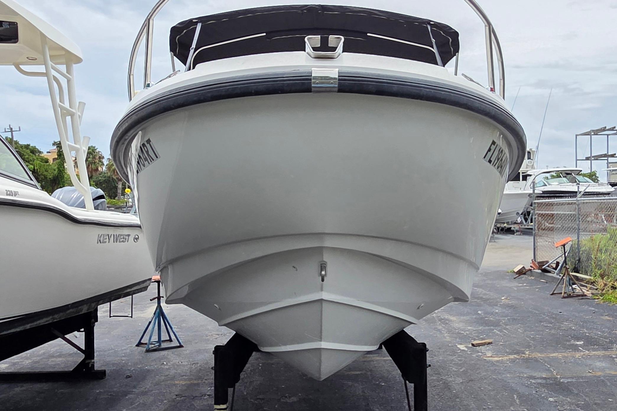 Front view of a 2000 Boston Whaler 21 Ventura boat on a trailer.