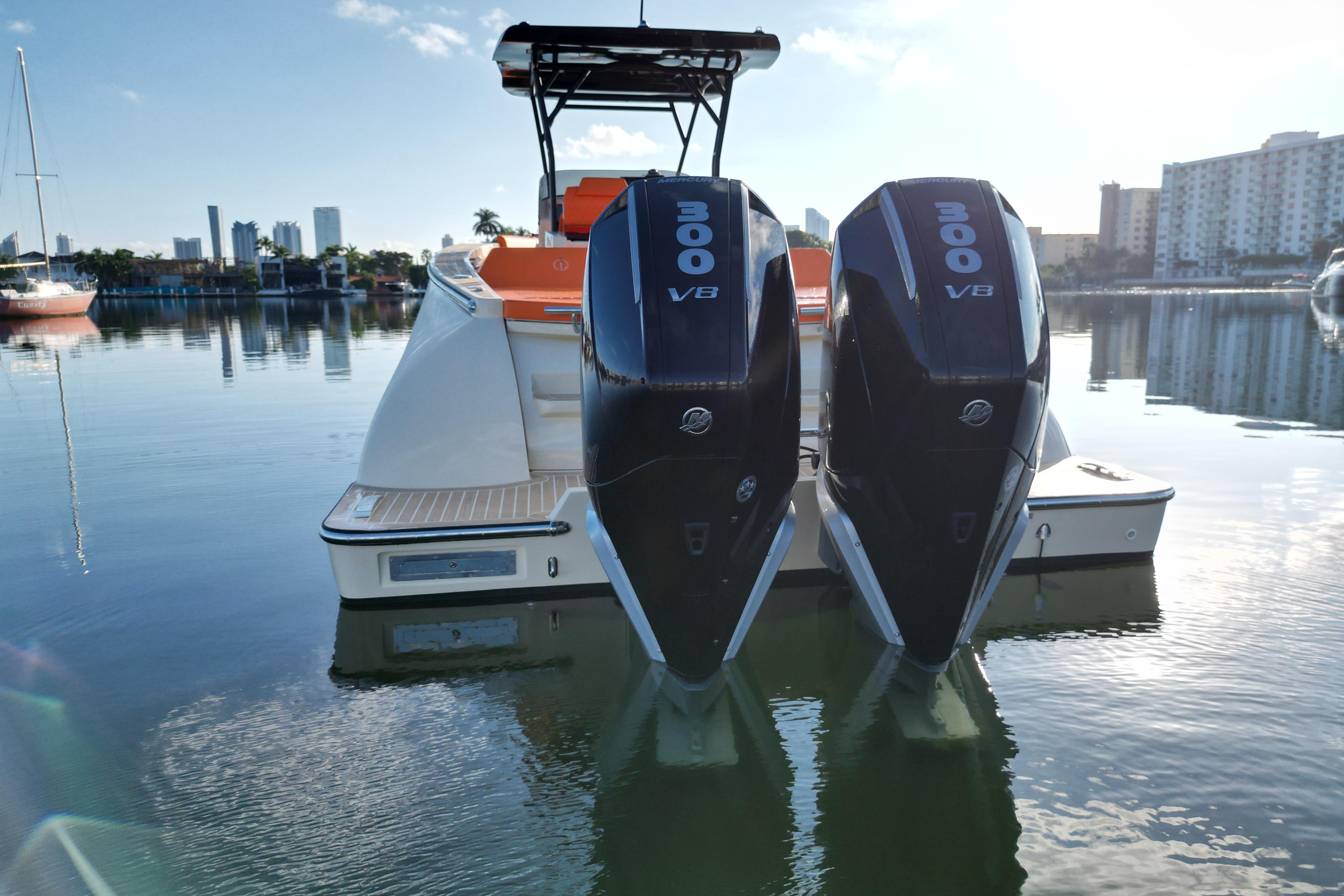 2026 Lilybaeum Lipari 31 boat with dual 300 V8 engines docked in a serene marina.