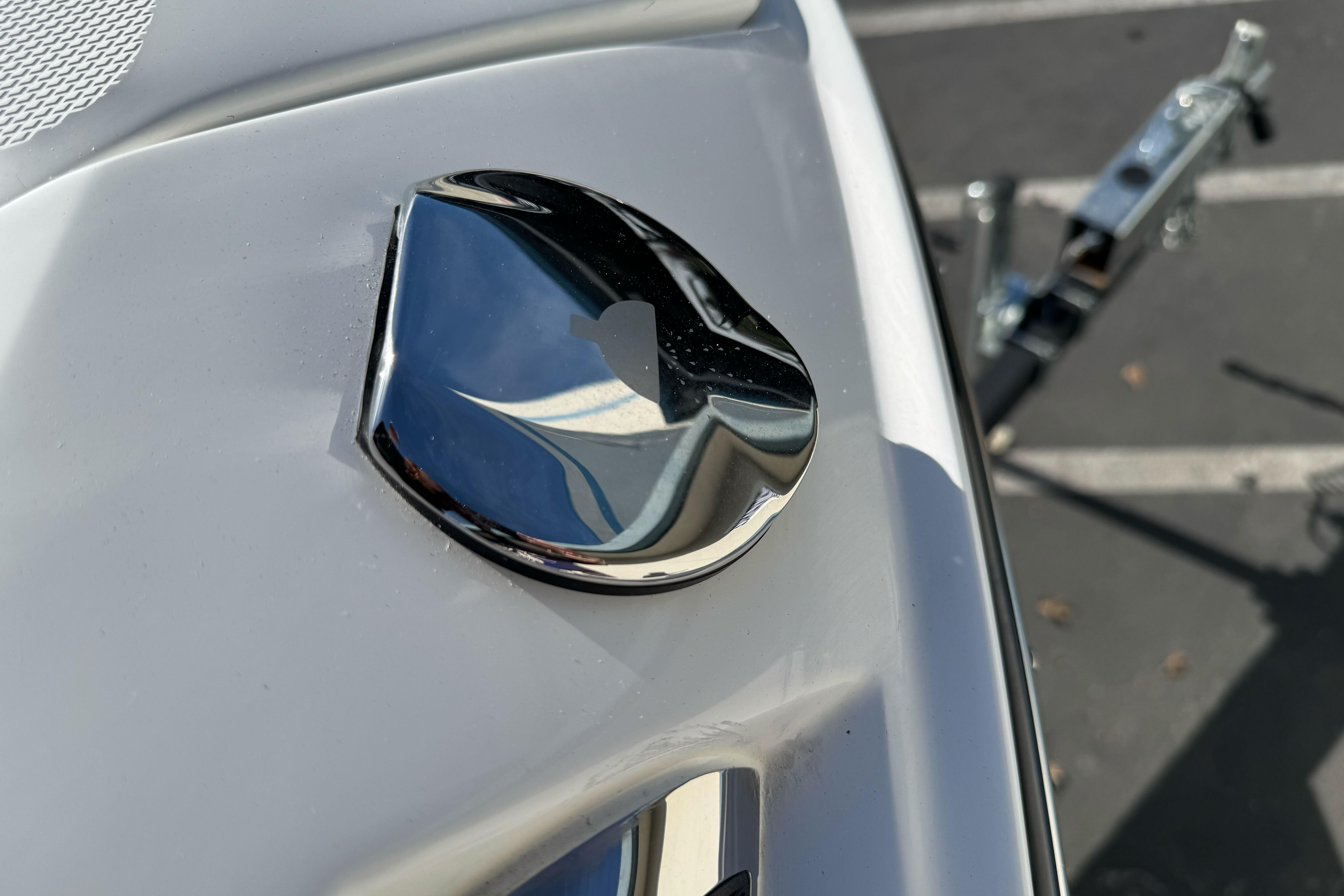 2026 Sea Ray SLX 260 boat emblem on a sleek white surface.