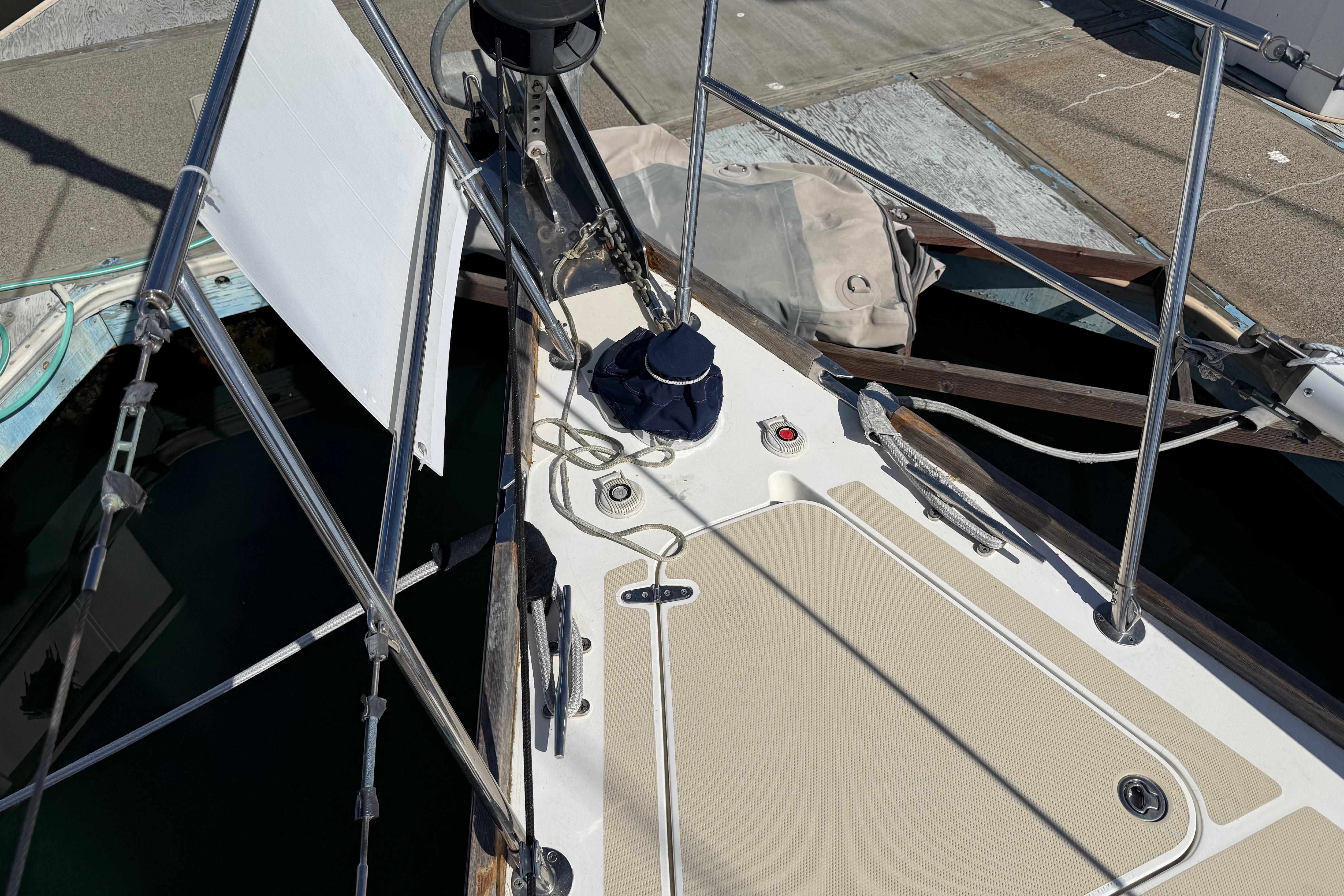 Deck of a 2004 Sabre 386 sailboat with rigging and winch details.