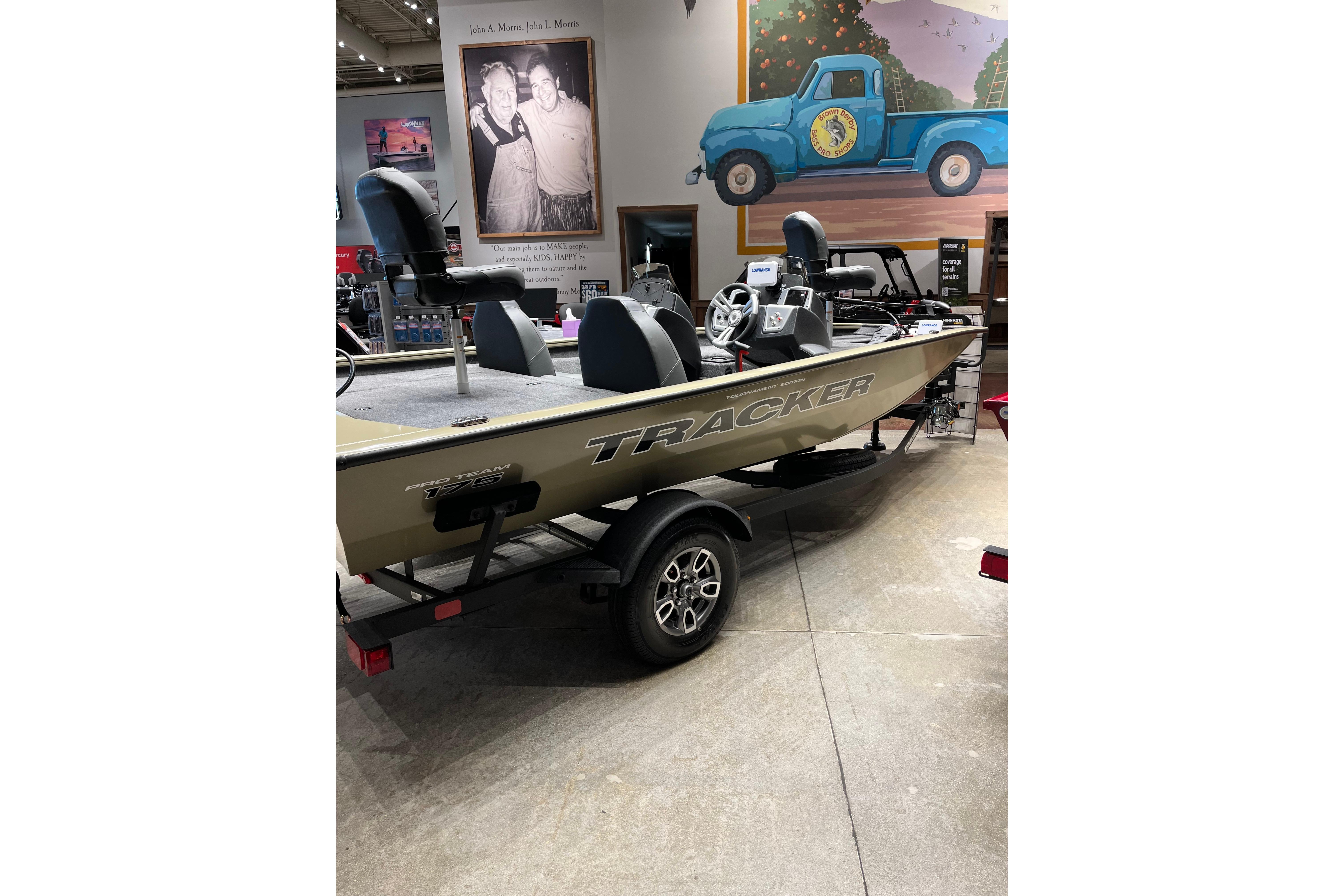 2026 Tracker Pro Team 175 boat on display in a showroom with vintage decor.