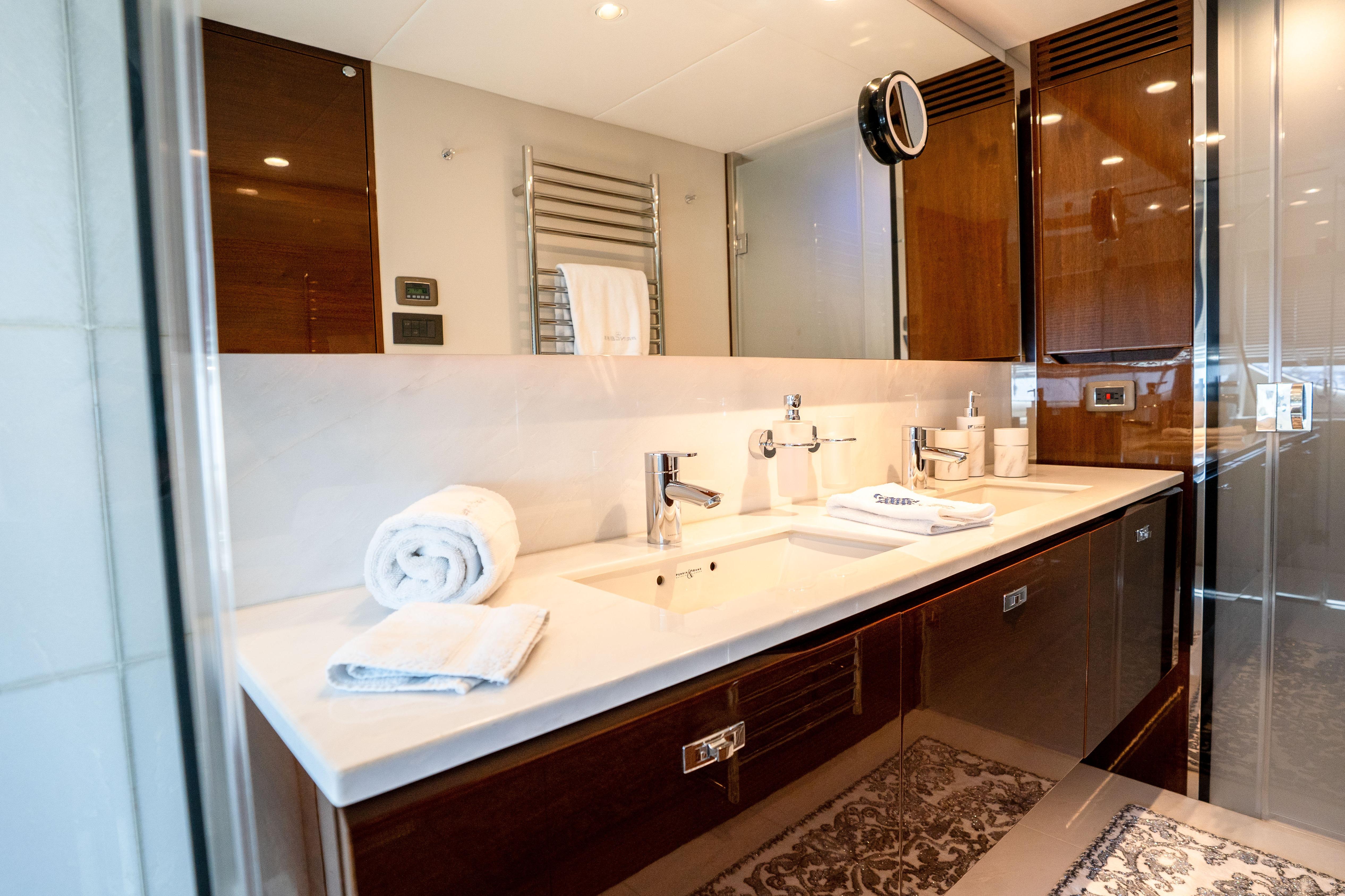 Luxurious bathroom in 2020 Princess Y85 yacht with elegant fixtures and modern design.