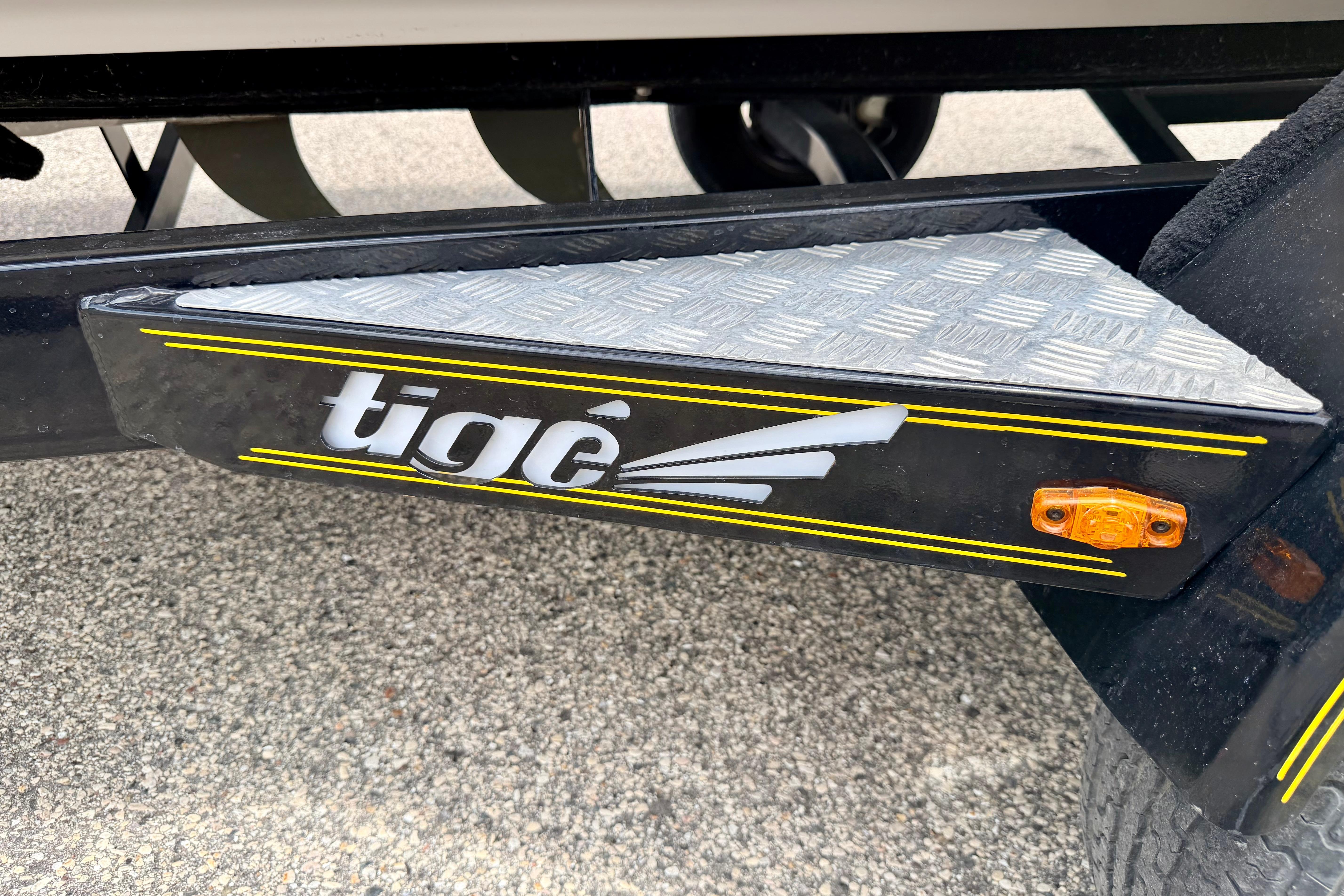 2014 Tigé R20 boat trailer with logo and reflective step plate.
