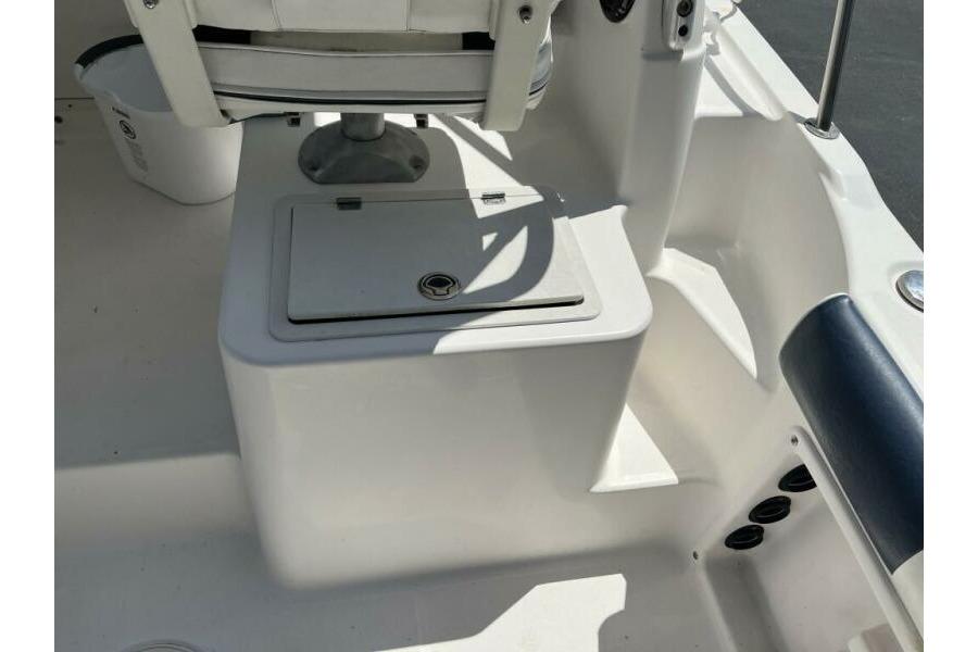 2006 Century 2400 Walk-Around boat interior with seating and storage compartment.