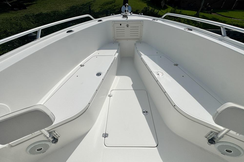 2018 Mako 284 Center Console boat interior with seating and storage compartments.