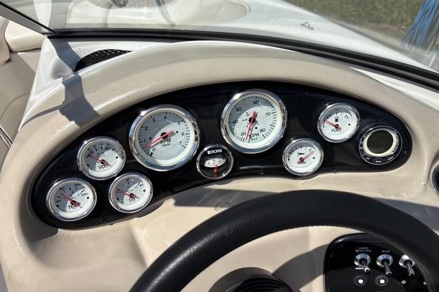Dashboard of a 2012 Tahoe Q8 SSi boat with multiple gauges and controls.