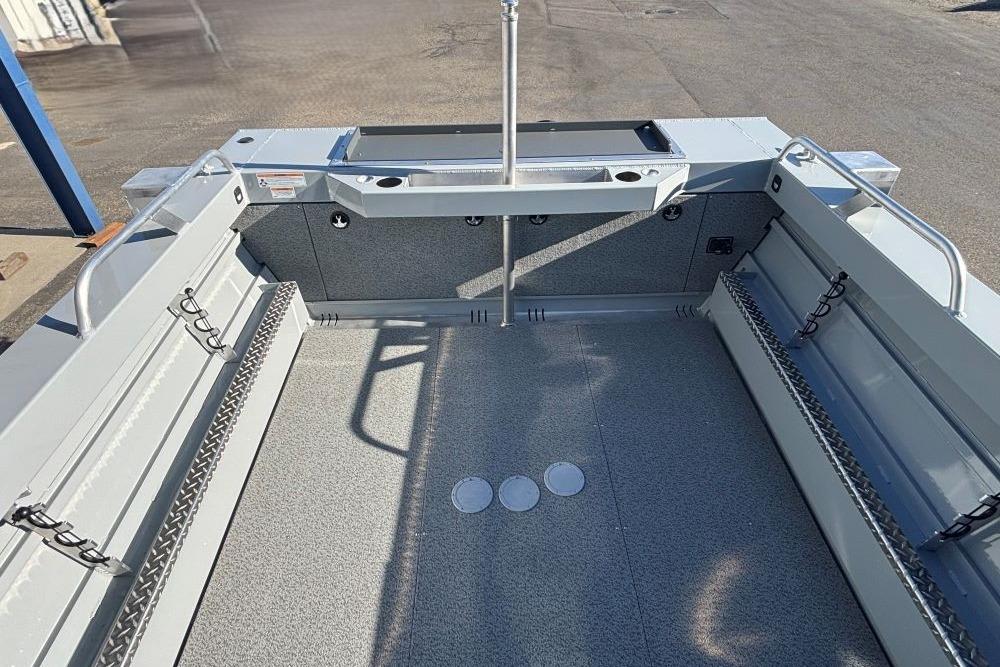 Interior view of a 2025 Hewescraft 200 ProV ET boat, showcasing spacious deck and storage features.