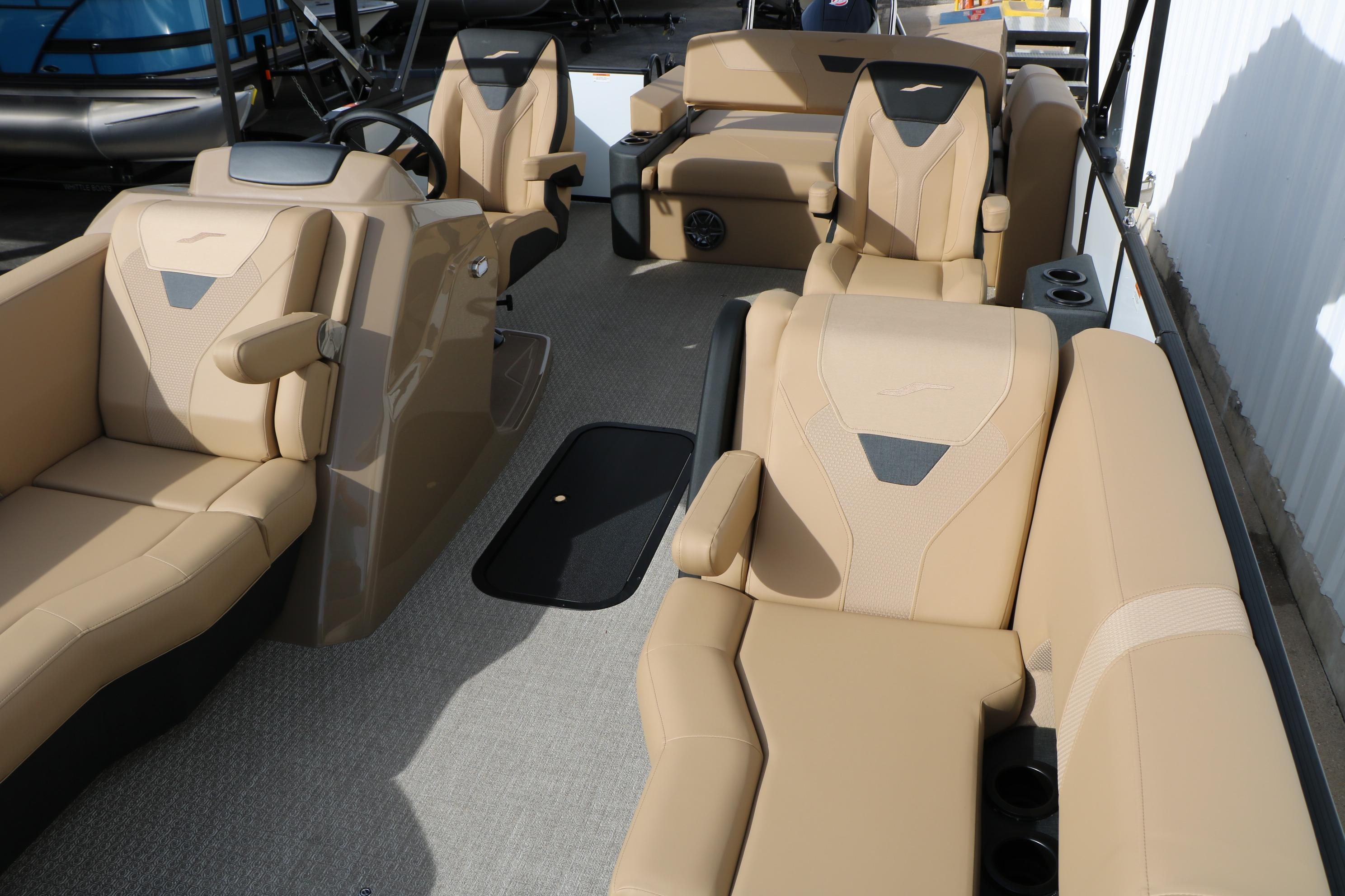 Luxurious interior of 2026 Evotti 523CS boat with beige seating and modern design.
