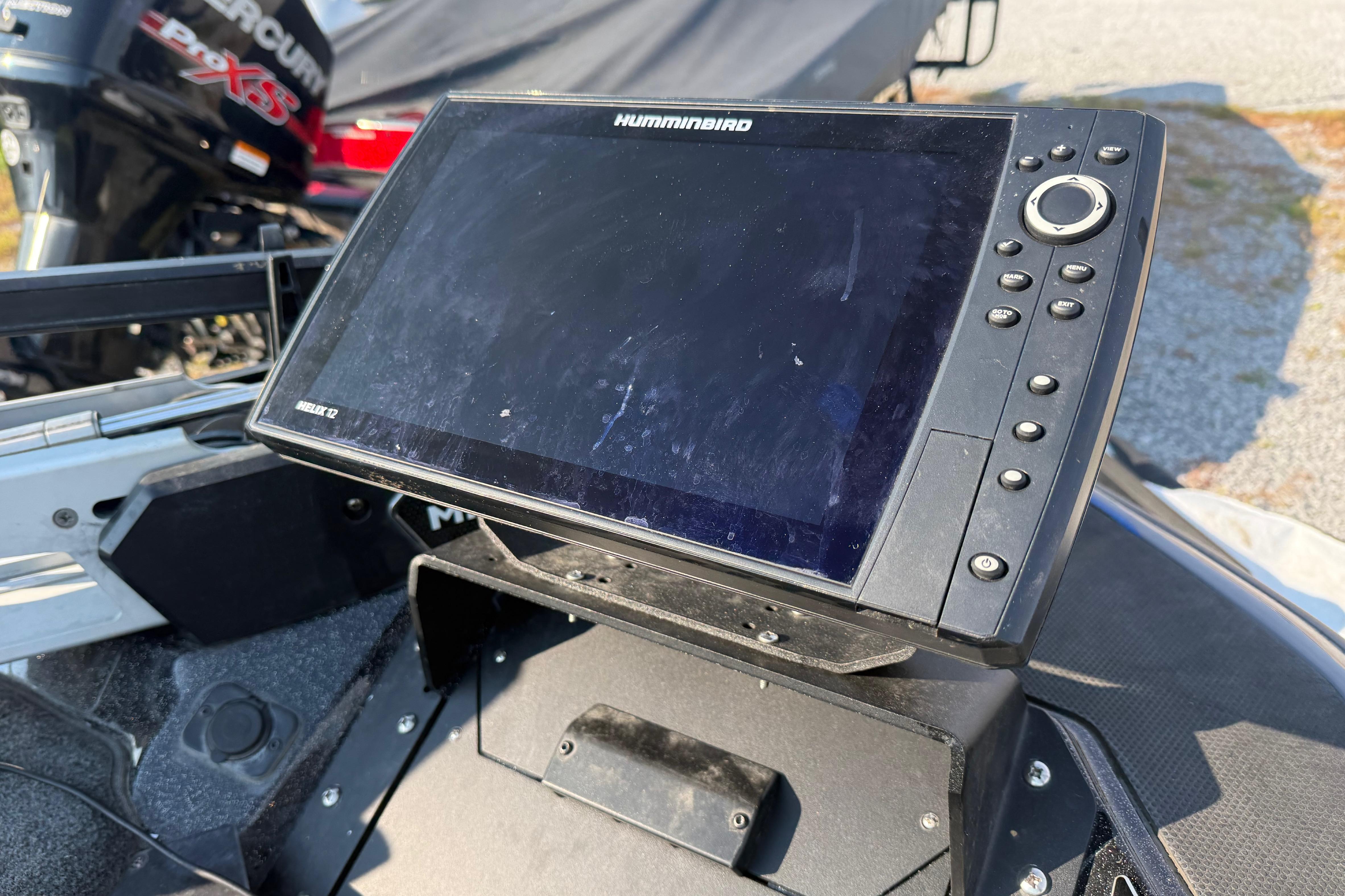 Humminbird fish finder on 2024 Skeeter FXR21 boat, with Mercury Pro XS engine in background.