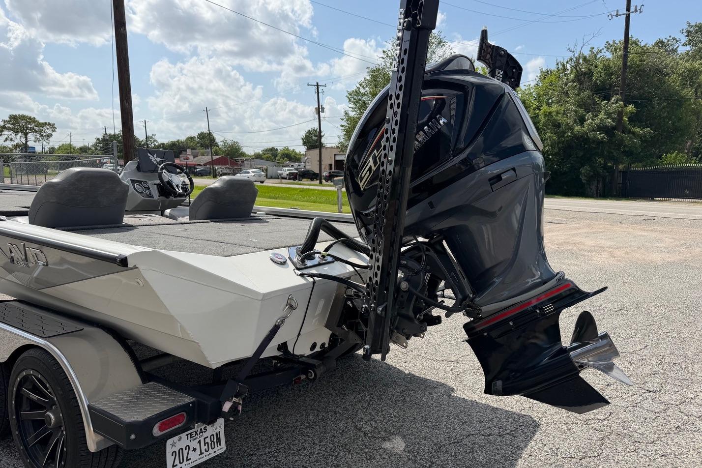 2024 Avid 21 XB Elite boat with Yamaha outboard motor on trailer.