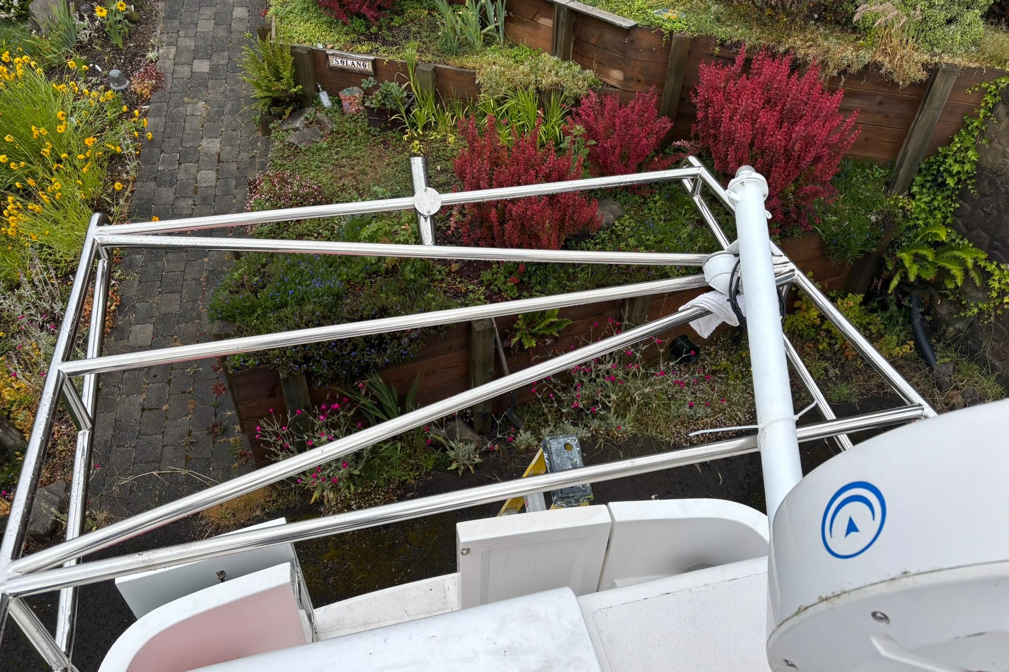 Rooftop view of a 2020 SeaPiper 35 boat with garden background.