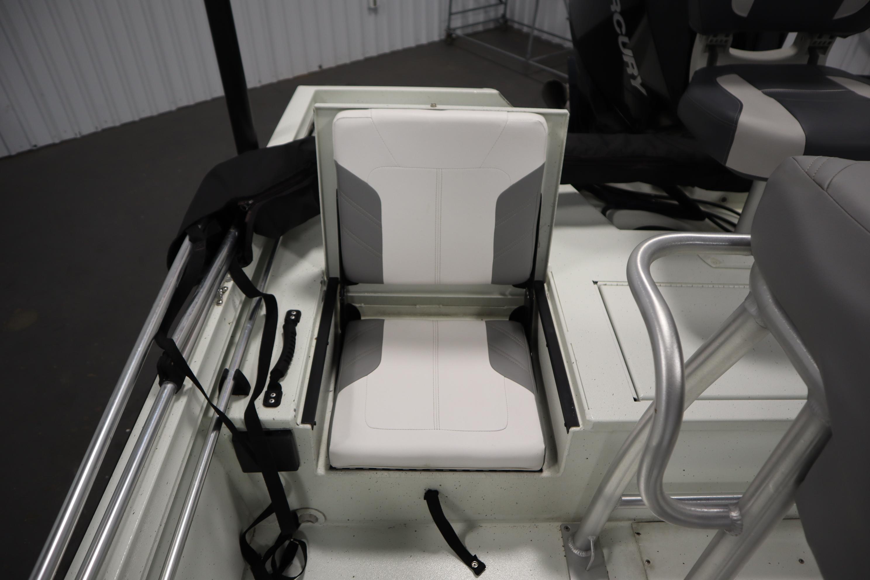 2022 Crestliner 2200 CC boat interior with foldable seat and storage compartment.