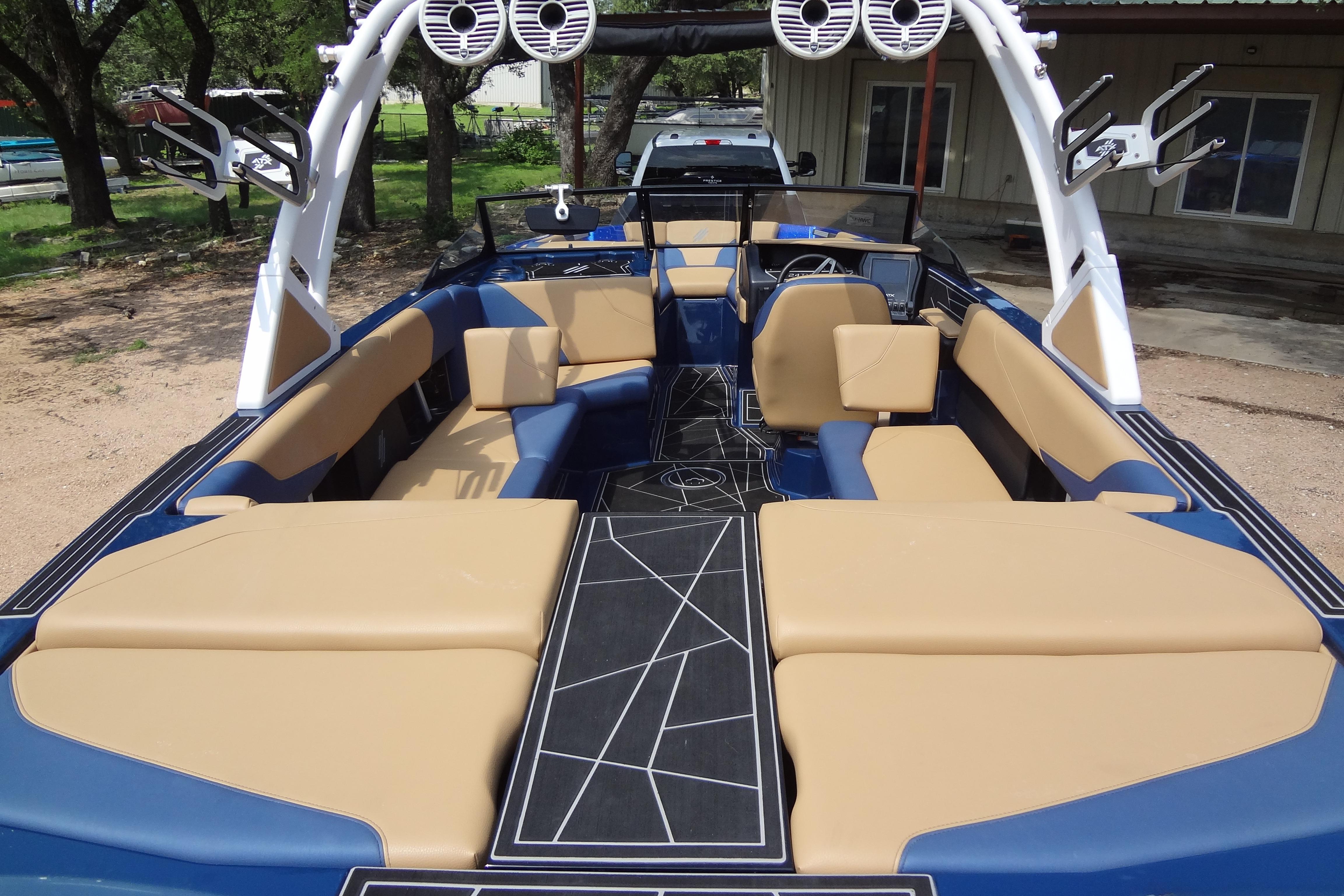 2022 ATX Surf Boats 24 Type-S interior with tan and blue seating, modern design.