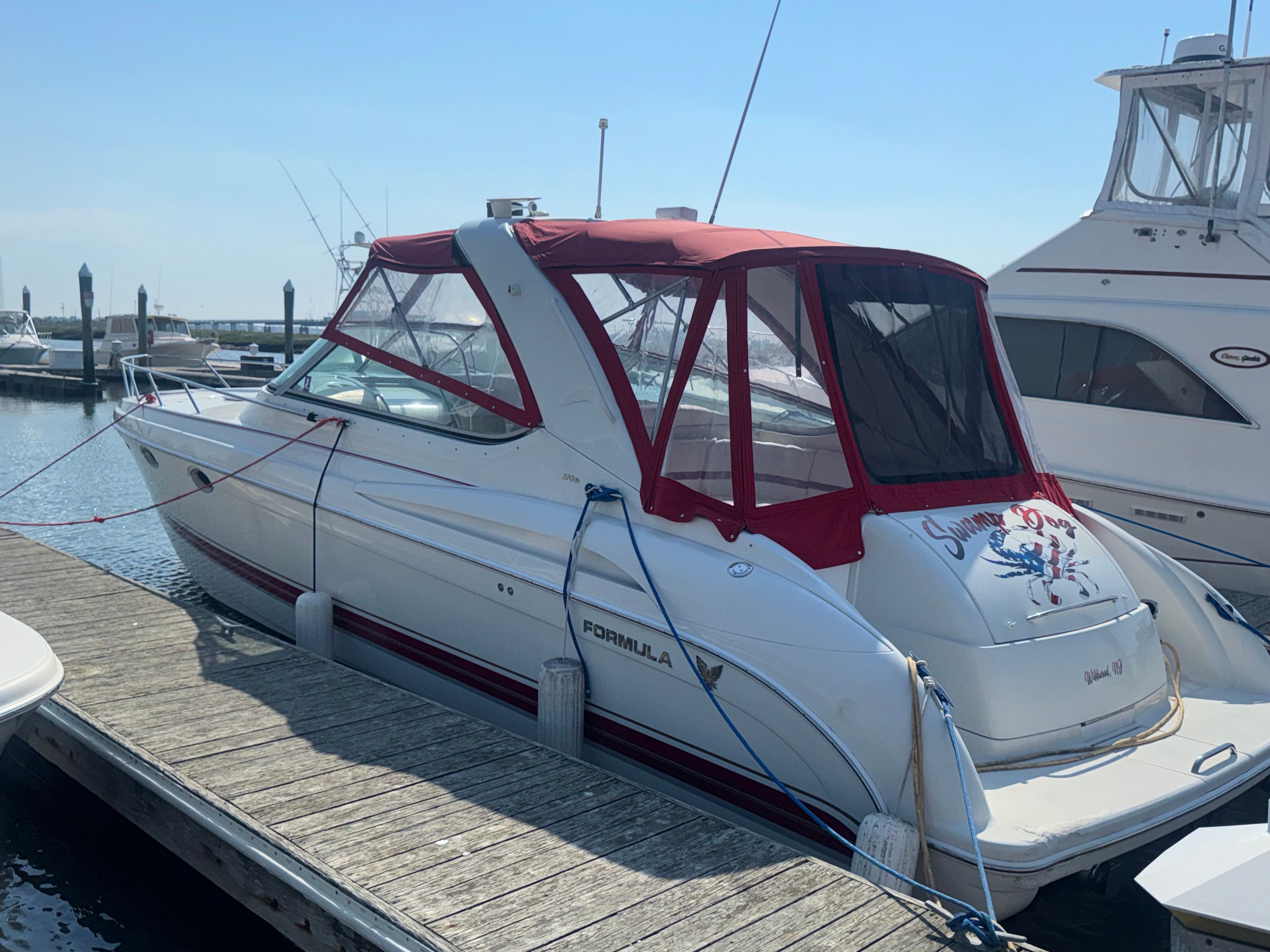 2001 Formula 37 Super Sport boat docked at marina.