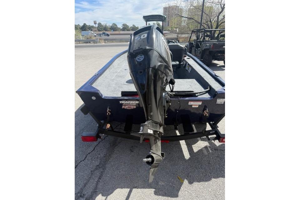 2026 Tracker Super Guide V-16 SC boat with outboard motor on trailer.