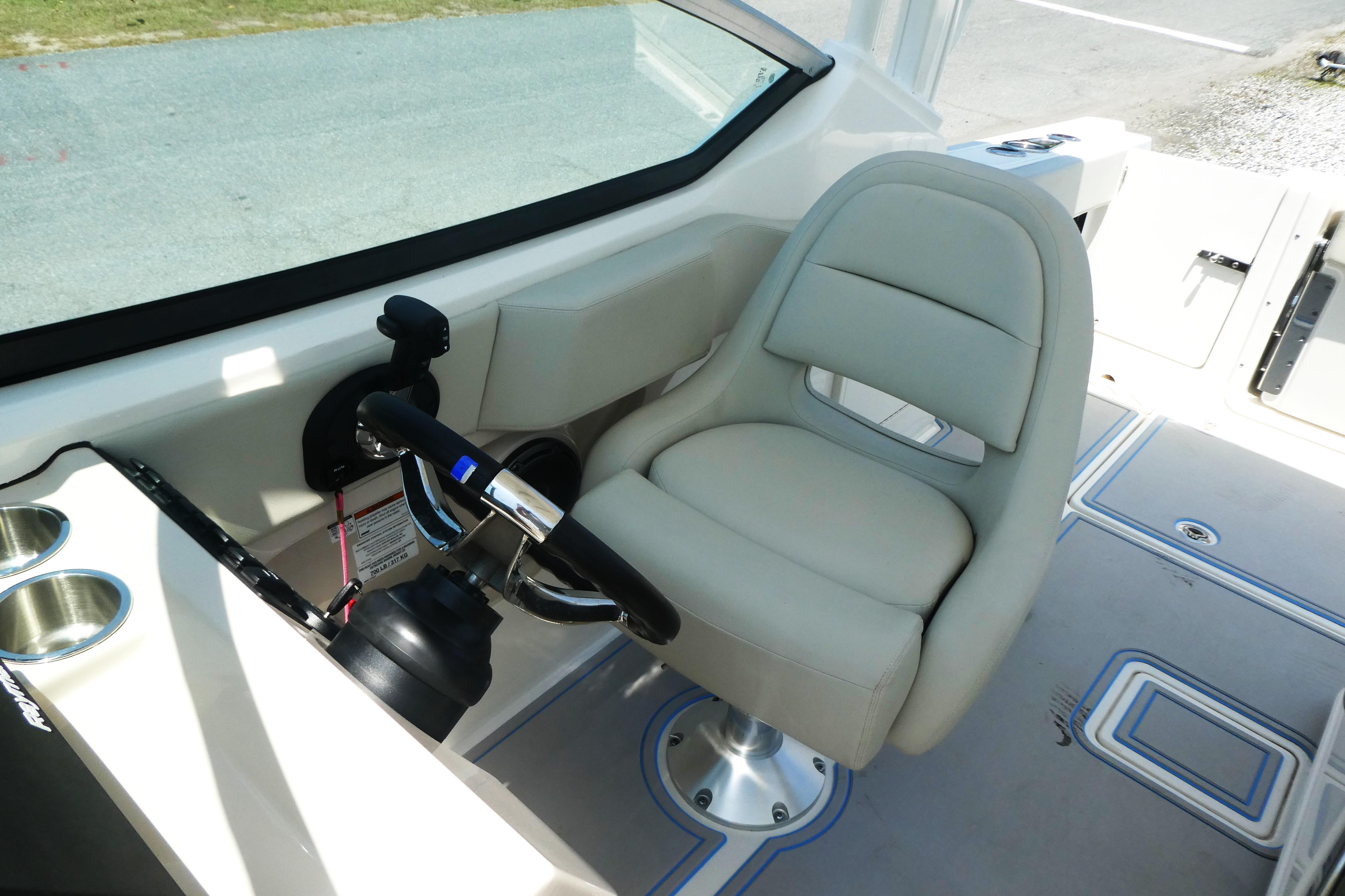 2022 Boston Whaler 240 Vantage helm with comfortable seating and modern controls.
