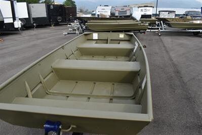2025 Lowe L1240 Jon boat in a parking lot, showcasing its spacious interior and sturdy design.