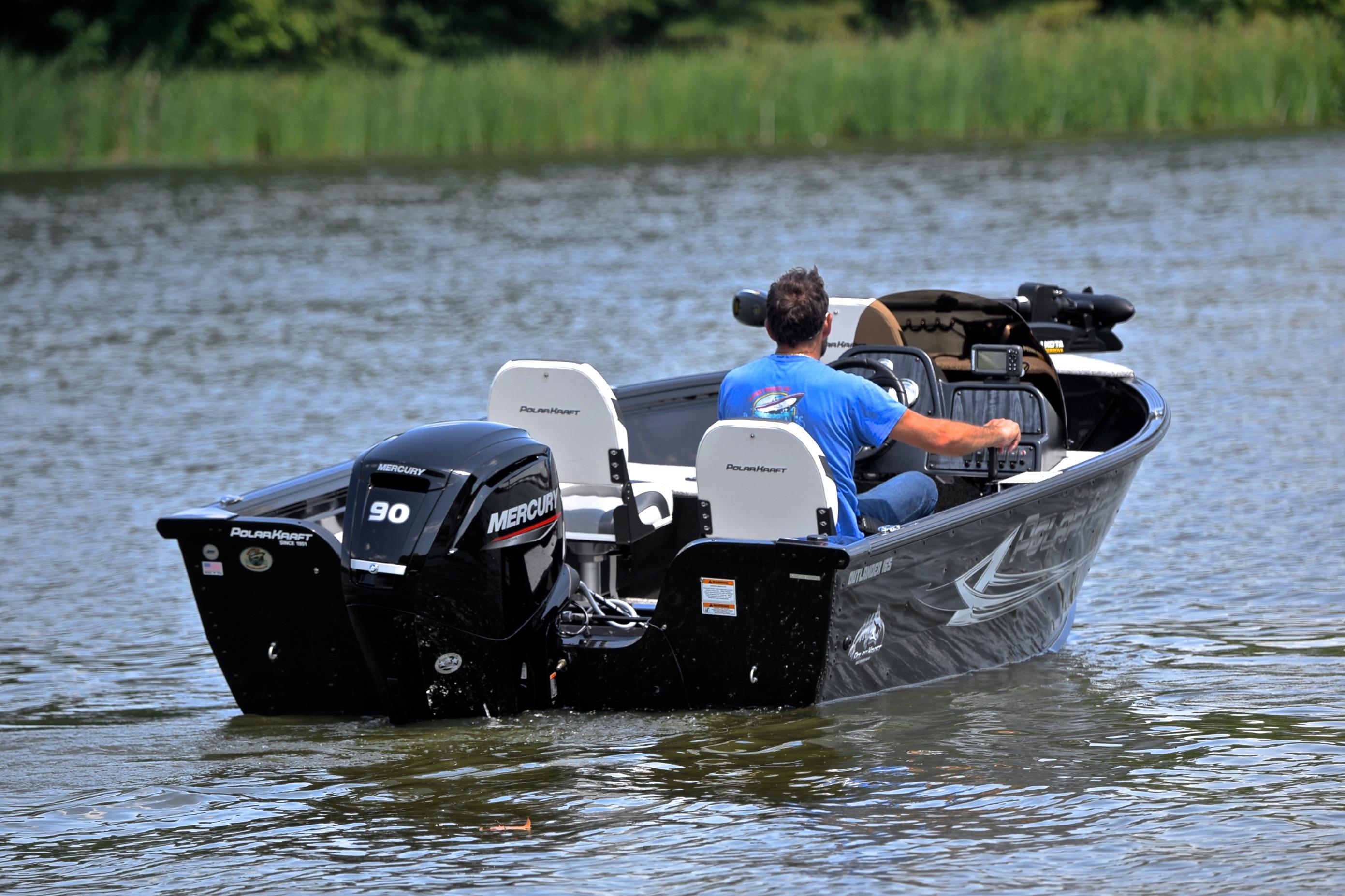 2024 Polar Kraft 165 boat with Mercury engine on a calm lake.