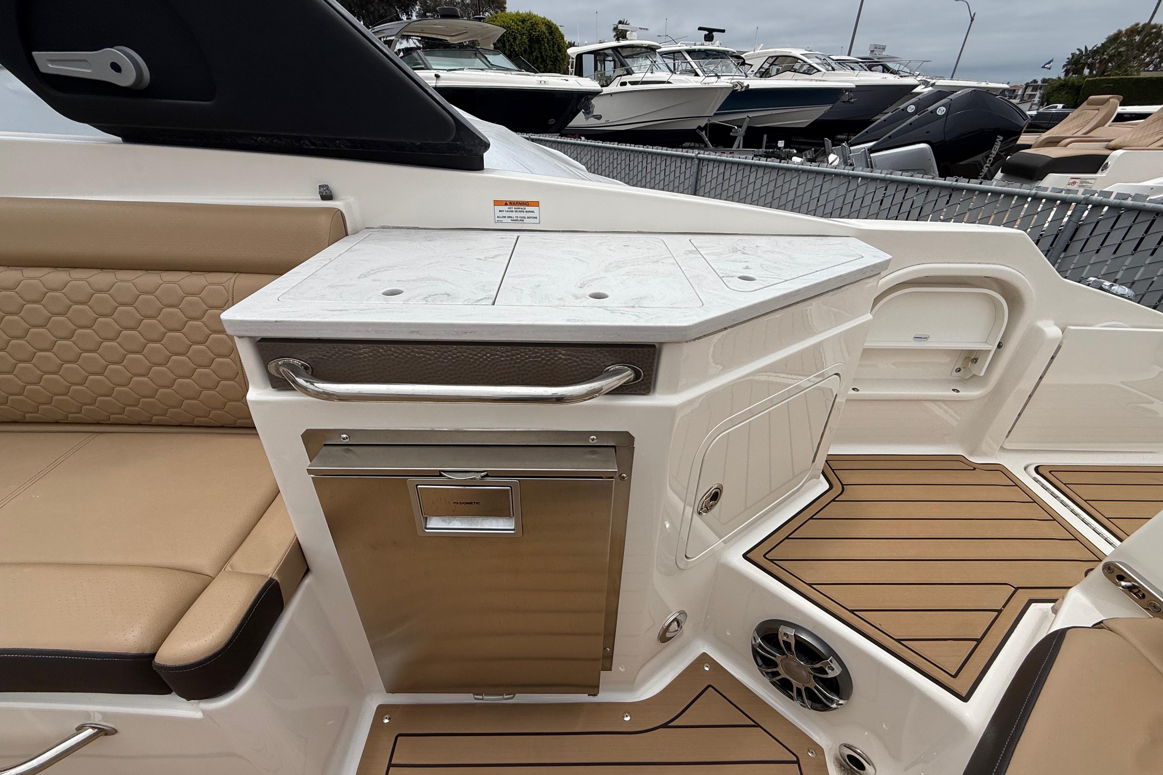2022 Sea Ray SDX 290 Outboard interior with seating and storage area.