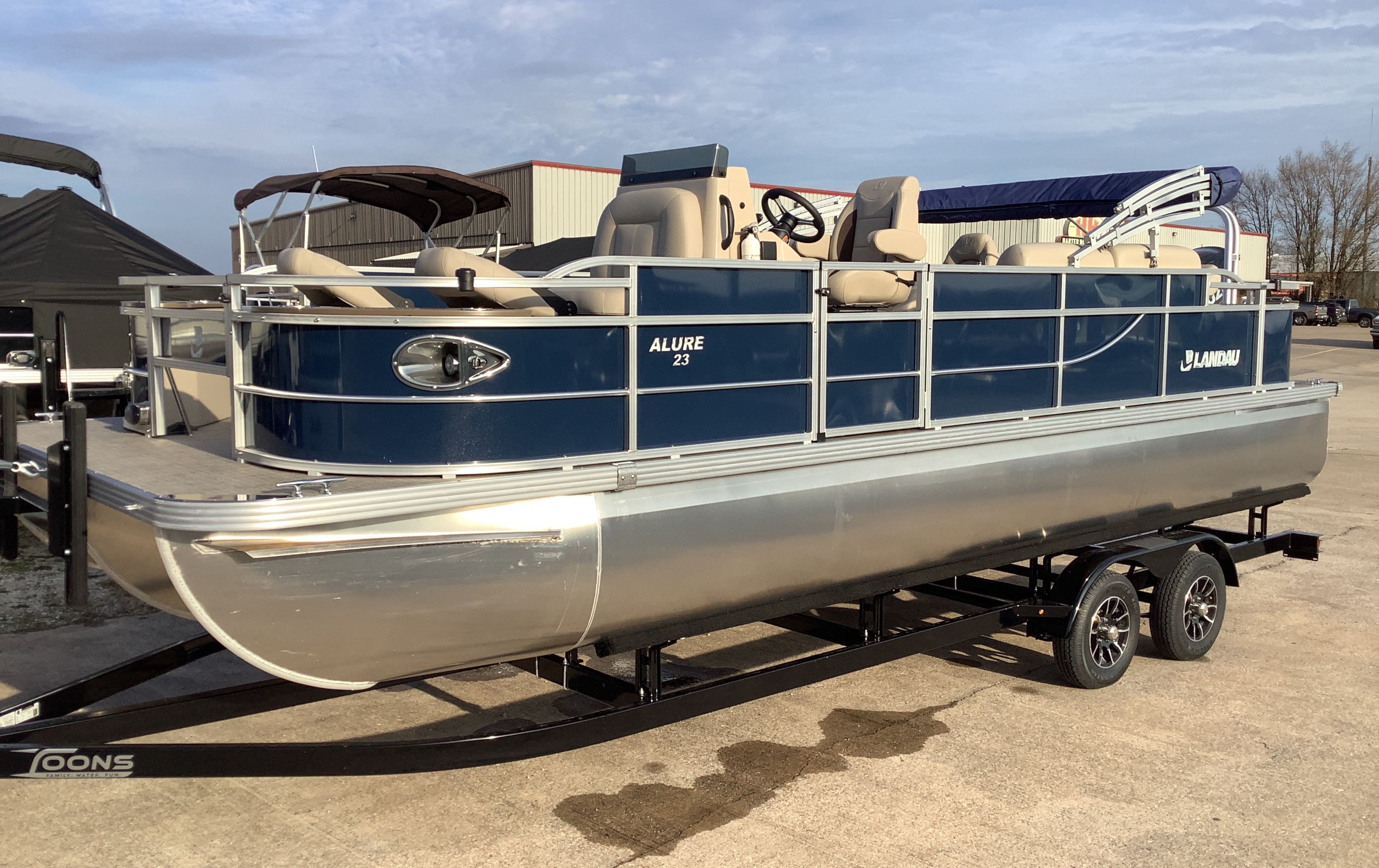 2026 Landau Alure 23CC Fish pontoon boat on trailer.
