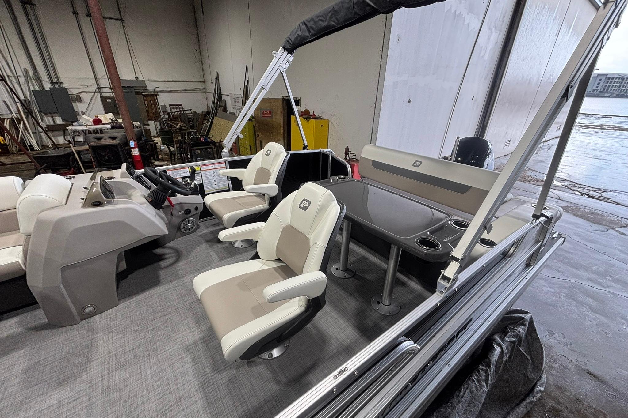2025 Princecraft Vectra 21 RL pontoon boat interior with seating and helm.