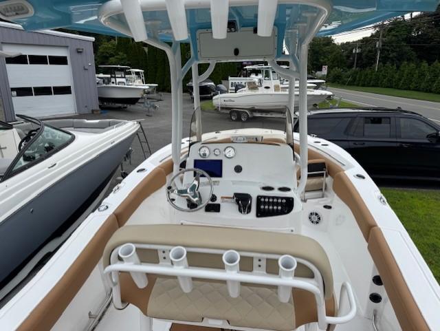 2025 NauticStar 222L Offshore boat interior with modern dashboard and seating.