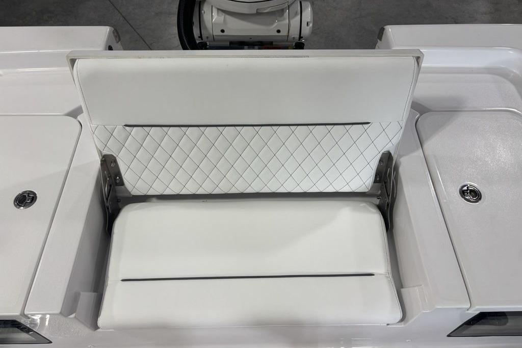 2026 Sportsman Masters 247 Bay Boat with white cushioned seating and diamond pattern backrest.